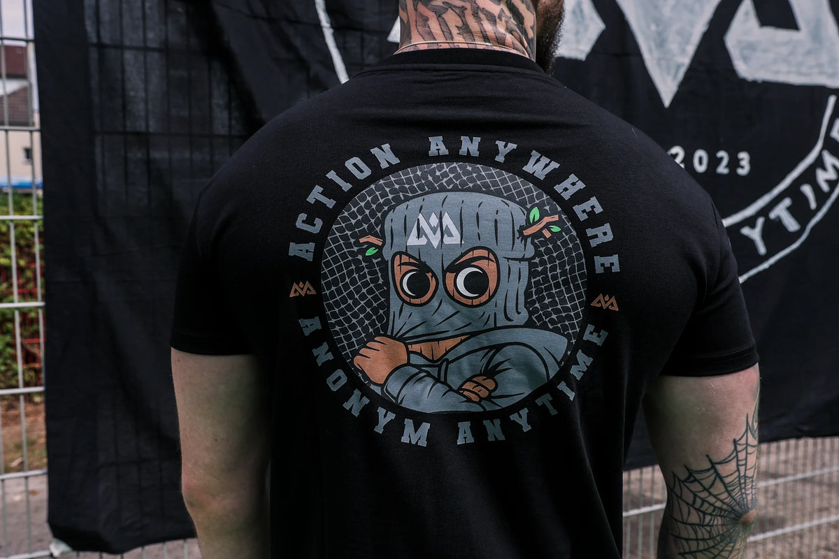 Close-up of cartoon graphic on black T-shirt back print