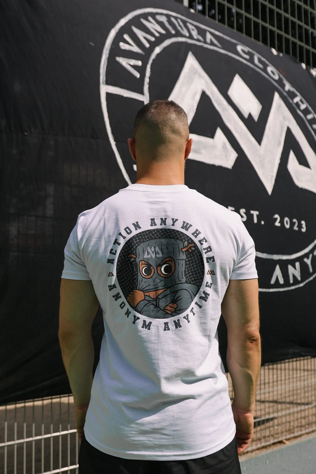 Back view of white T-shirt with circular graphic print