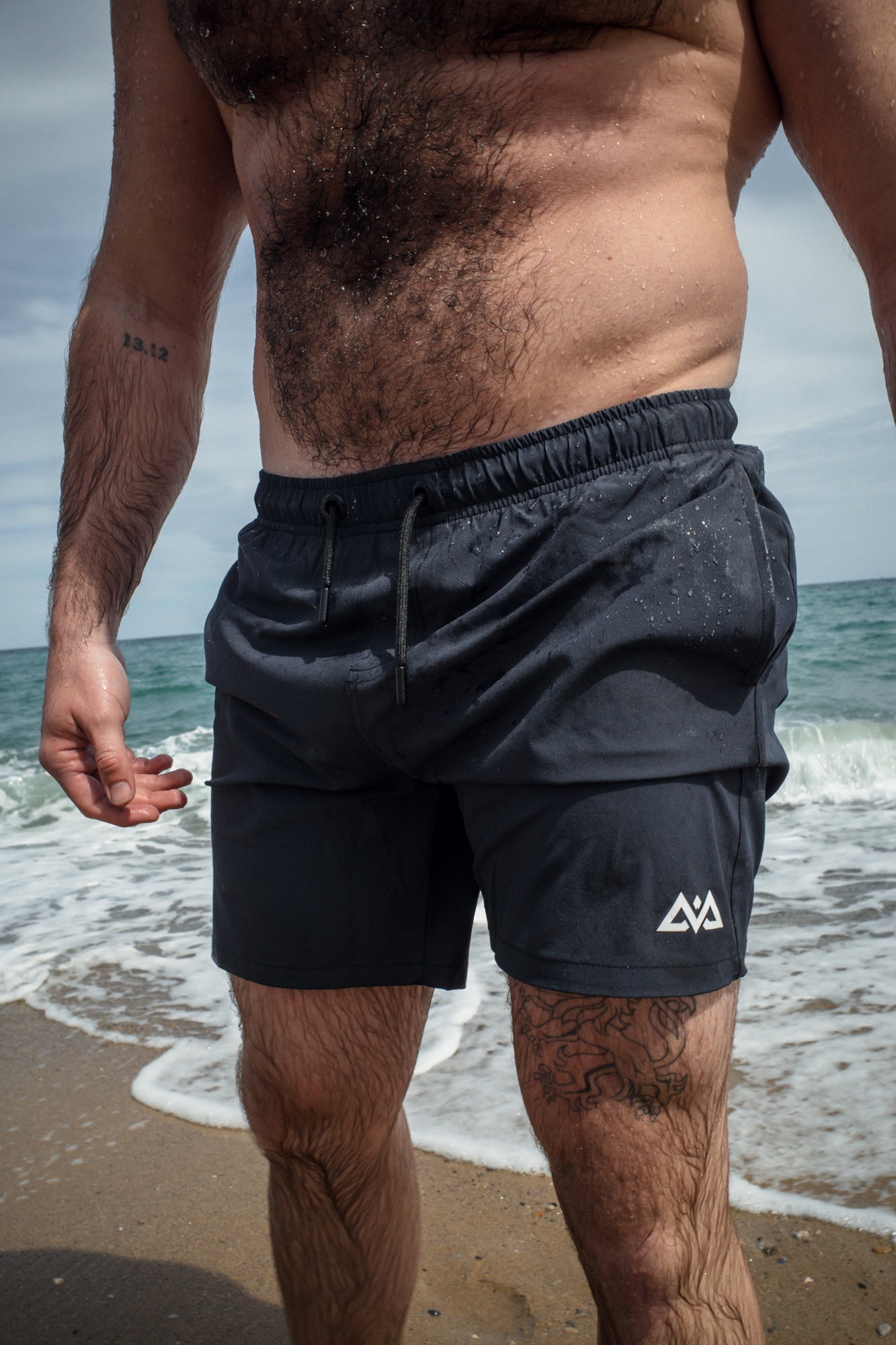 Front view of navy swim trunks with drawstring