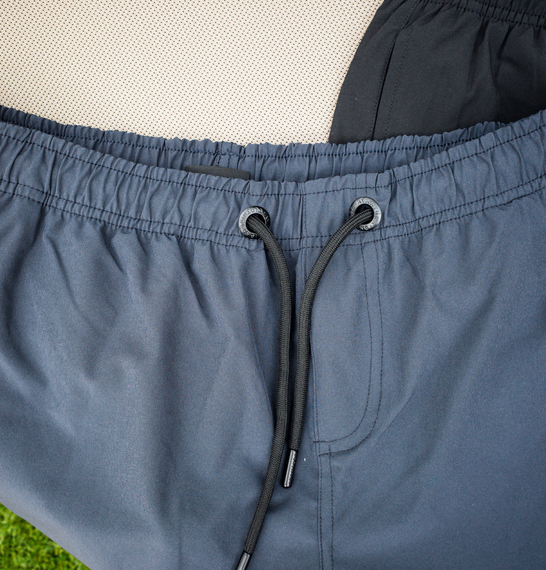 Close-up of elastic waistband and drawstring on swim trunks