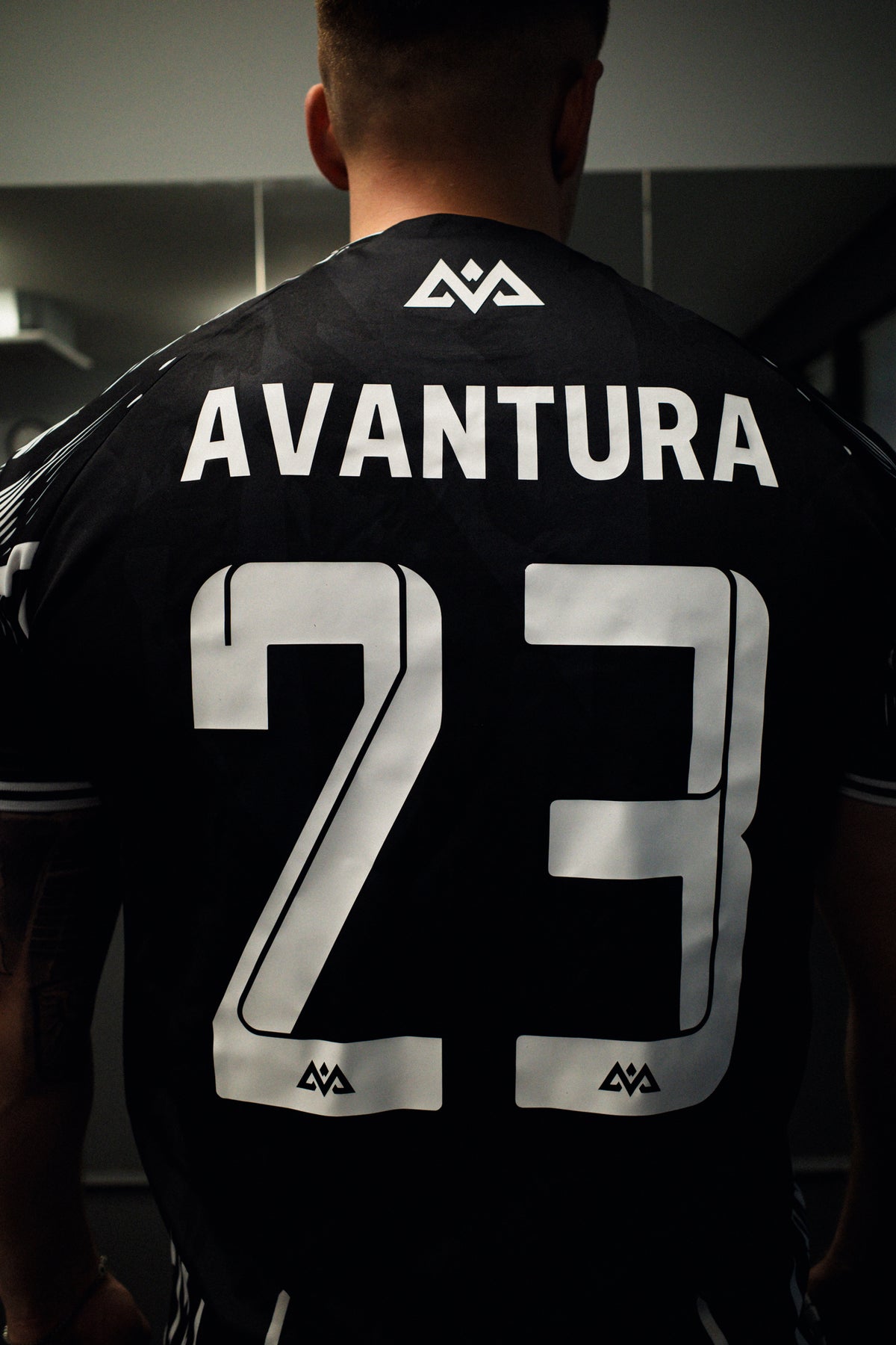 Back detail of black jersey showing reflective number 23 design