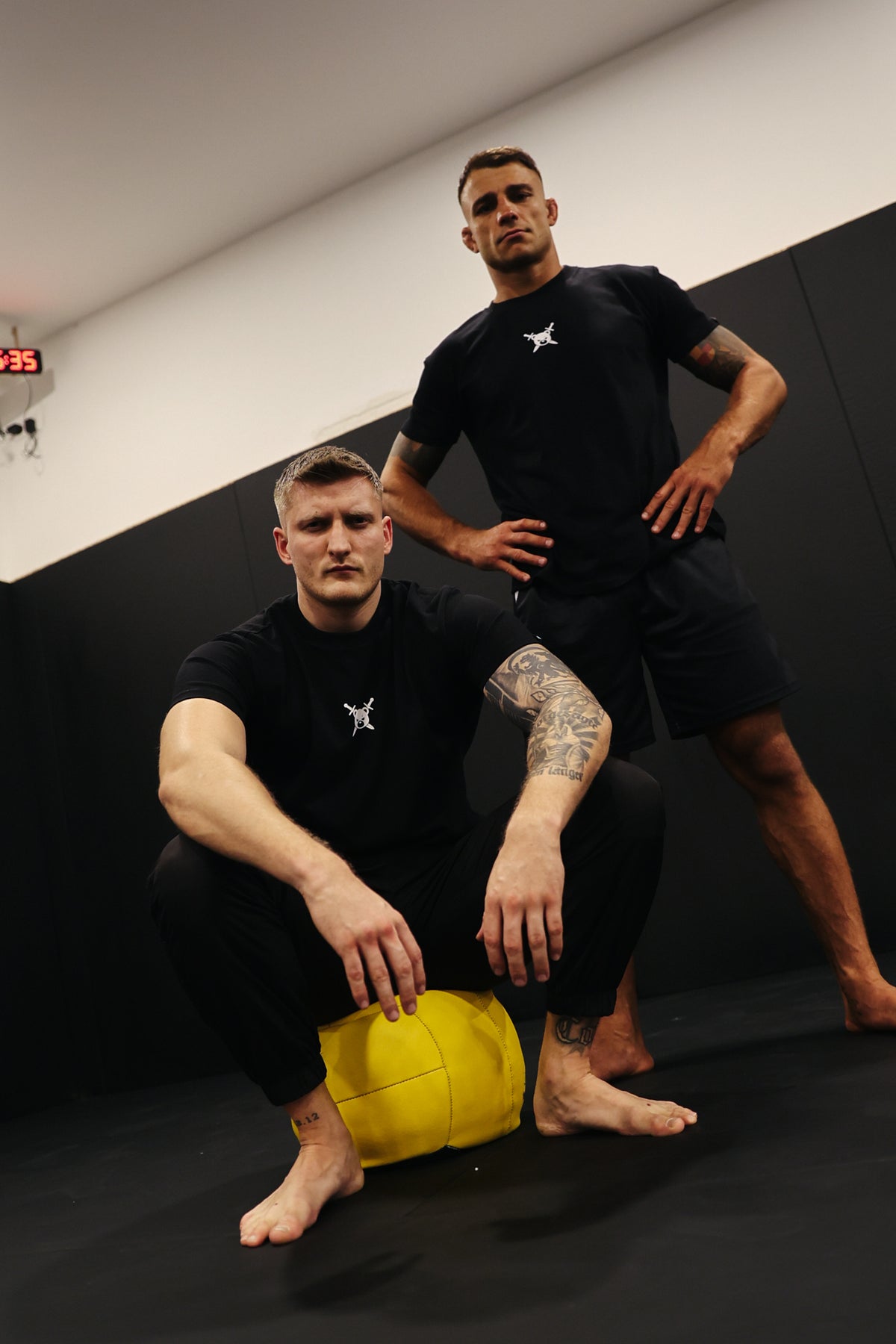 Black AVANTURA T-shirt during fitness training with a ball