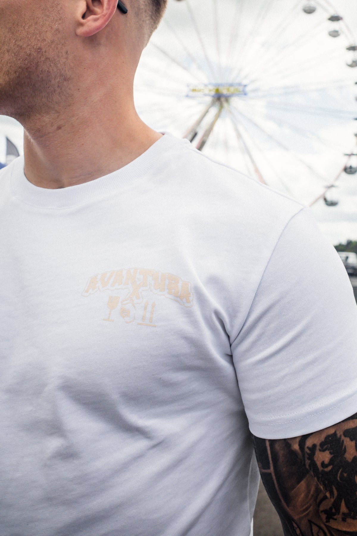 Close-up of white t-shirt vintage style font and crossed symbols logo