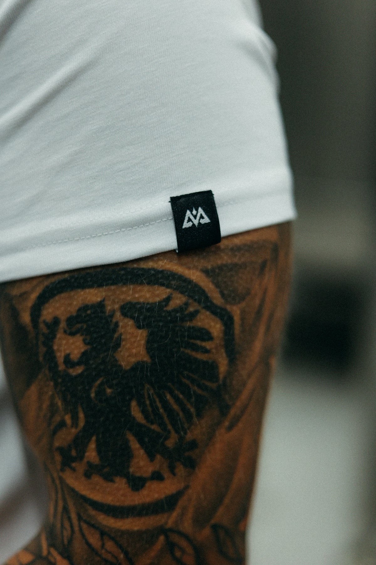 White T-shirt sleeve woven label close-up