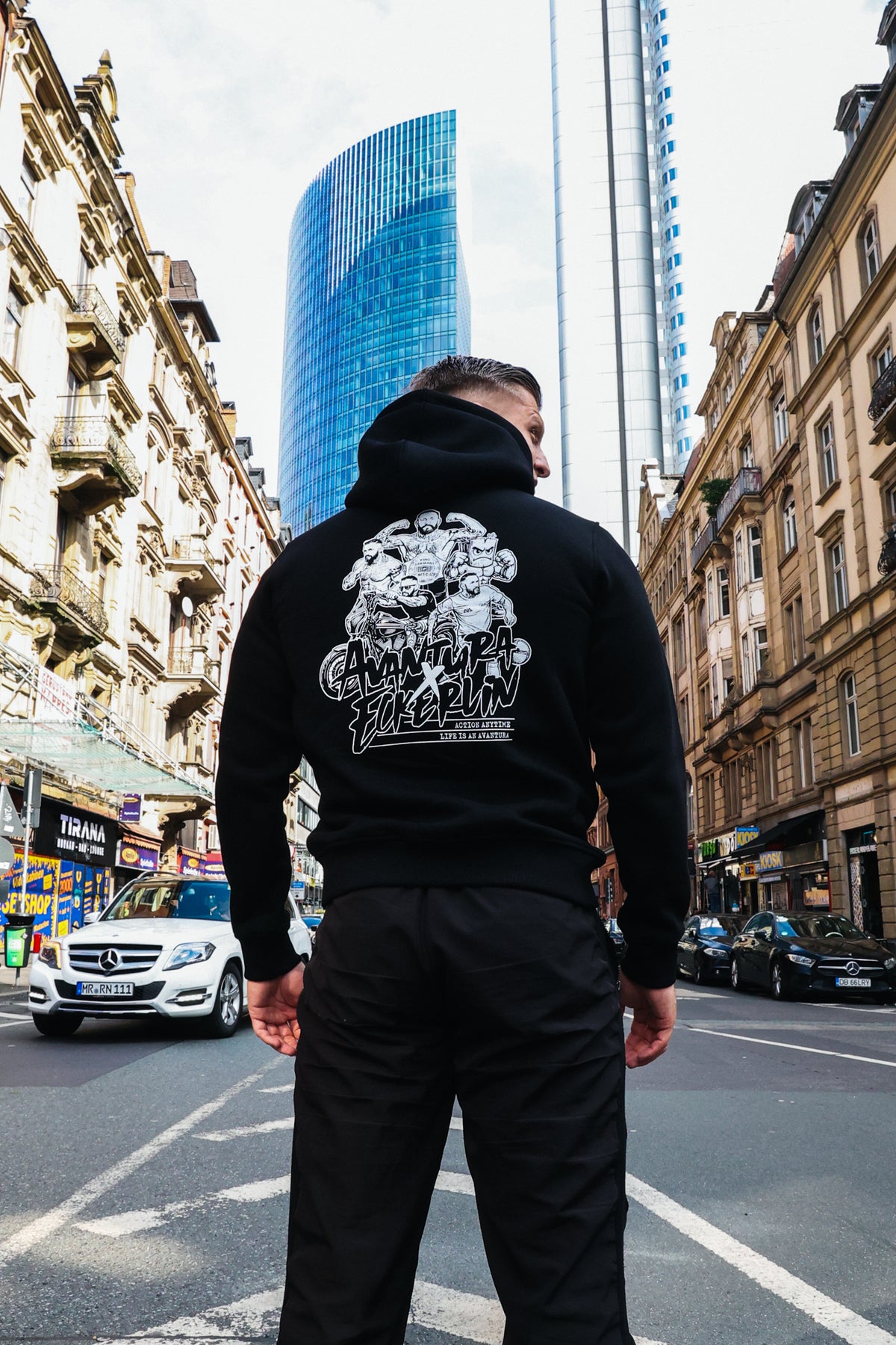 Black cotton-blend hoodie with high collar and bold back artwork