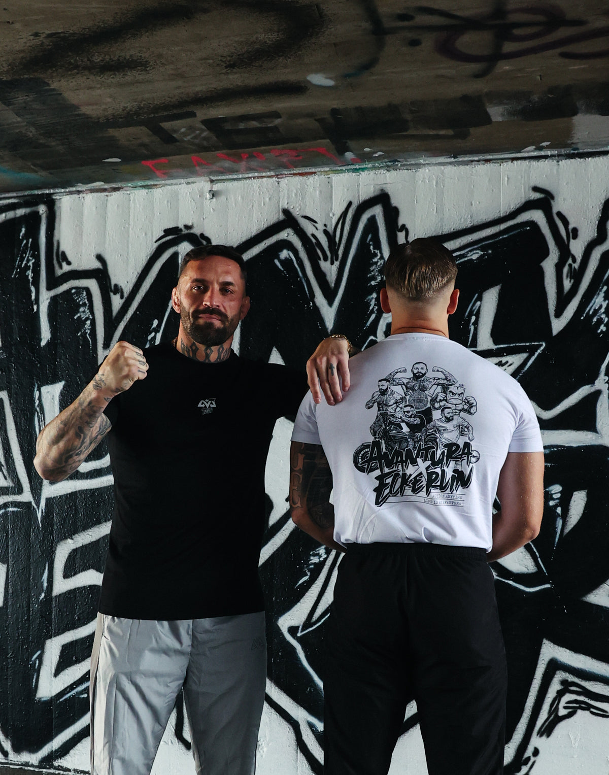 Black Avantura T-shirt with chest logo in streetwear style worn
