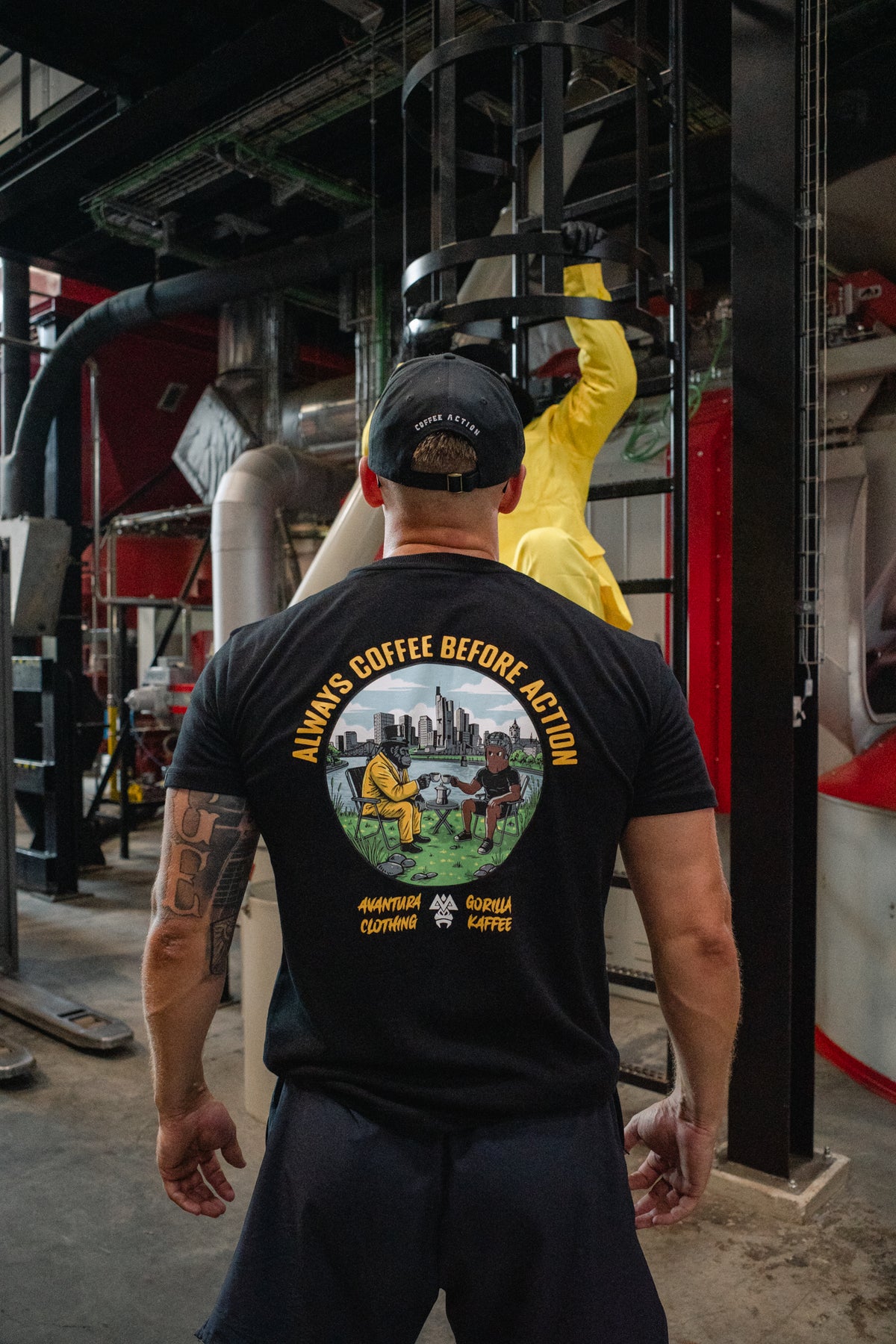 Rear detail of black t-shirt with colorful circular gorilla coffee scene print