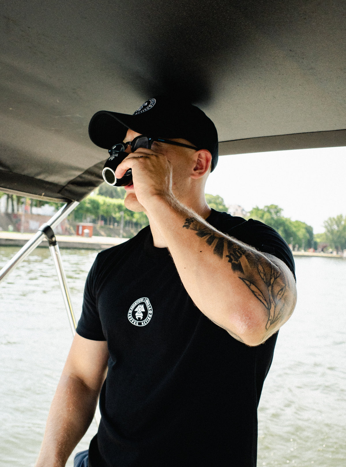 Close up of black t-shirt left chest logo featuring stylized gorilla head design