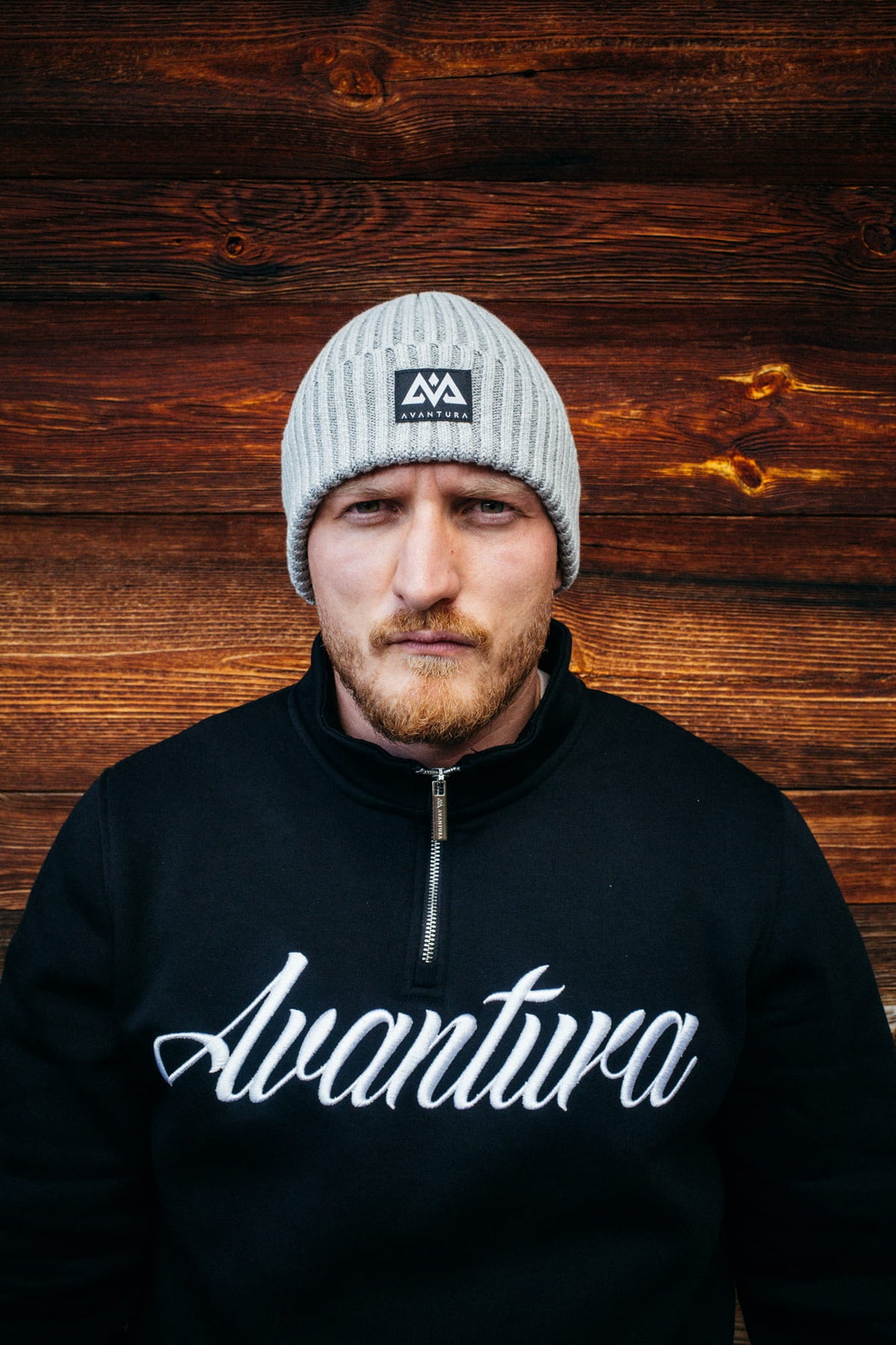 Light gray knit beanie with black AVANTURA logo patch