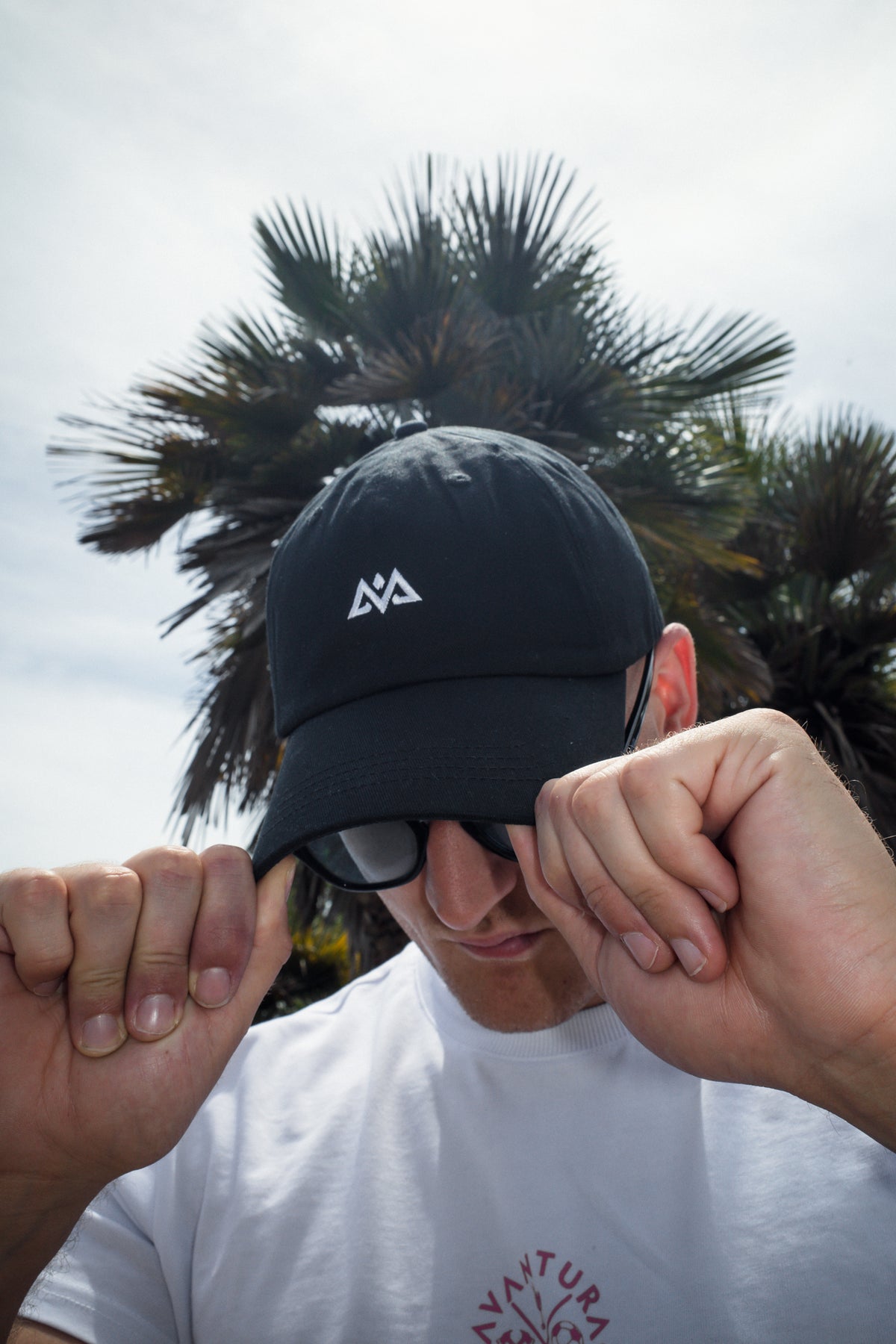 Black Avantura logo baseball cap front view