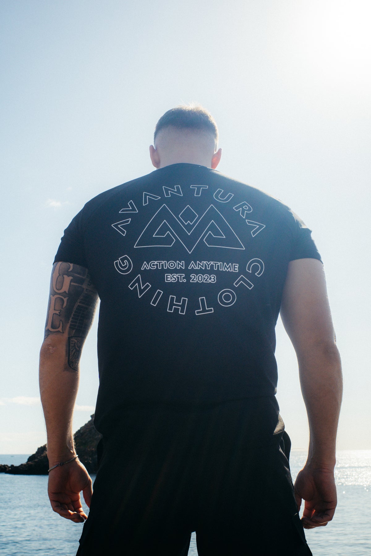 Geometric triangle logo on black T-shirt