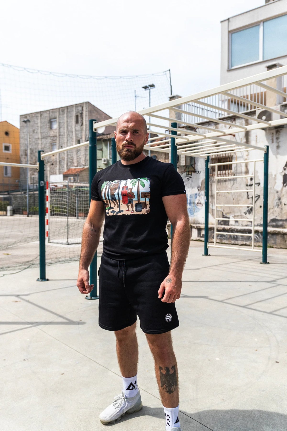 Black short-sleeve T-shirt with tropical color print on chest