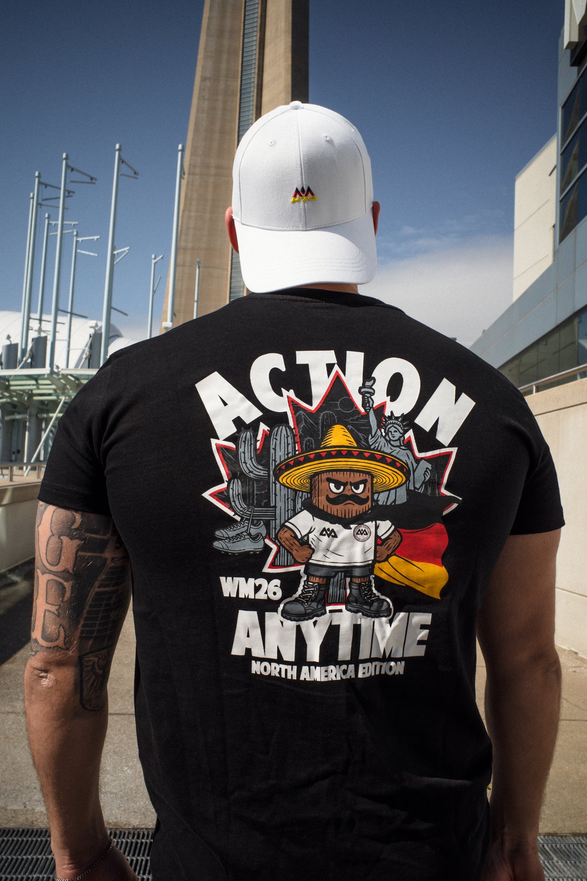 Outdoor shot of black T-shirt back design with WM26 North America Edition text