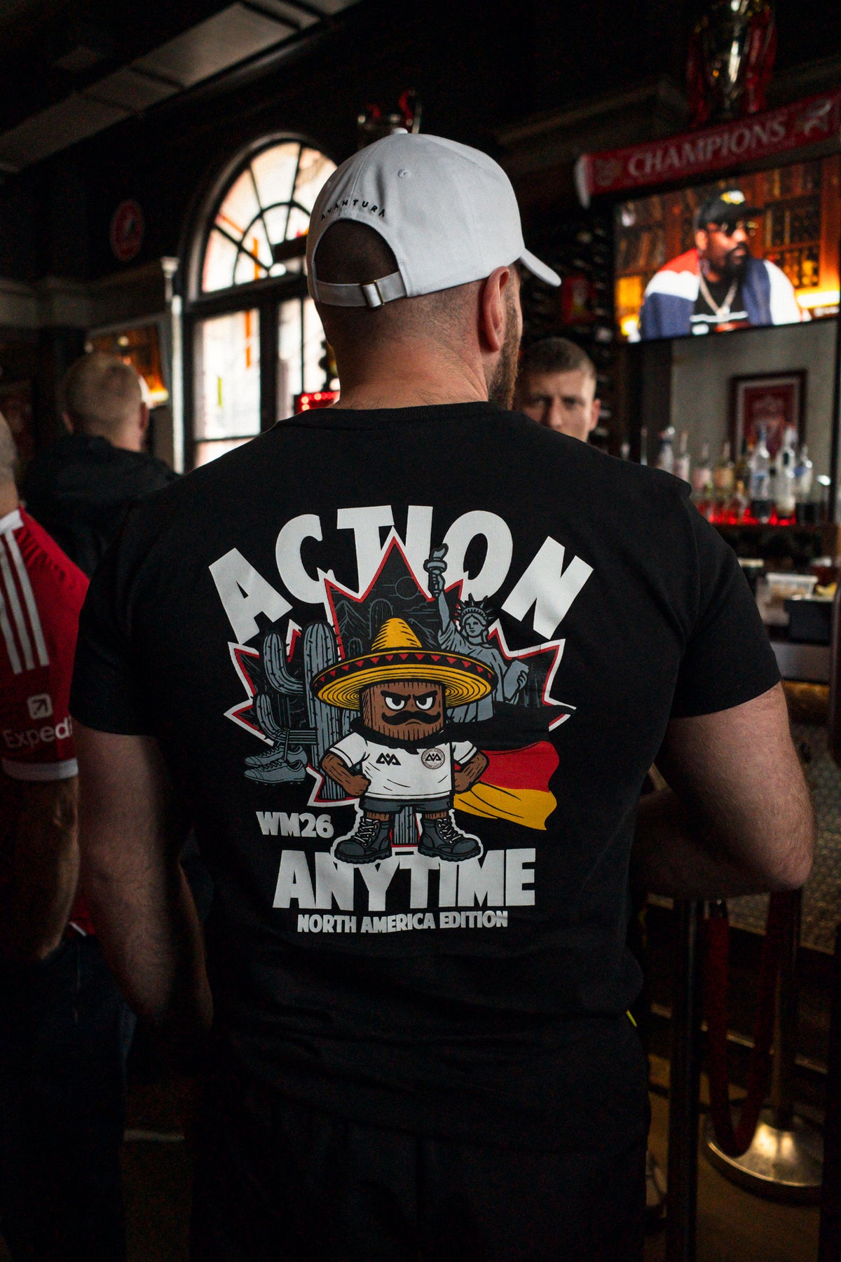Black T-shirt back print with Action Anytime North America Edition graphic