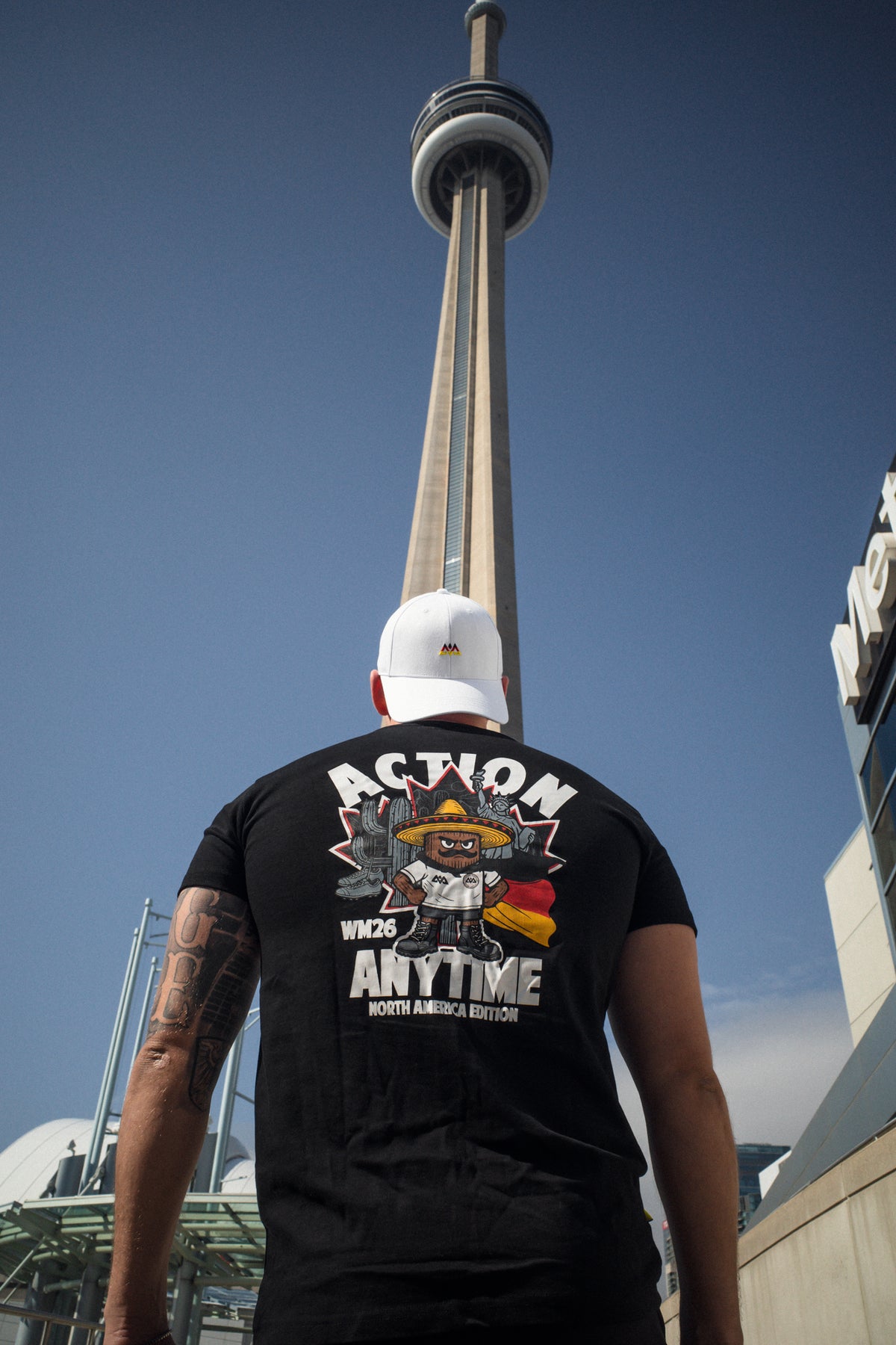 Black T-shirt back print featuring Canadian and US landmarks with German flag