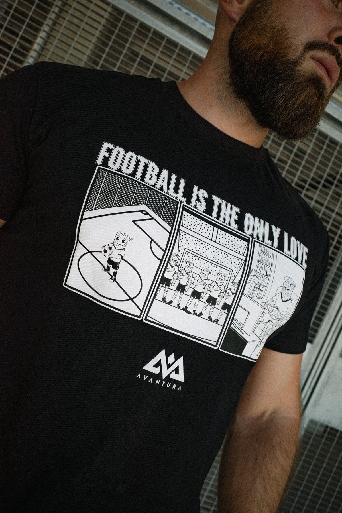 Detail shot of white screen-printed logo on black tee
