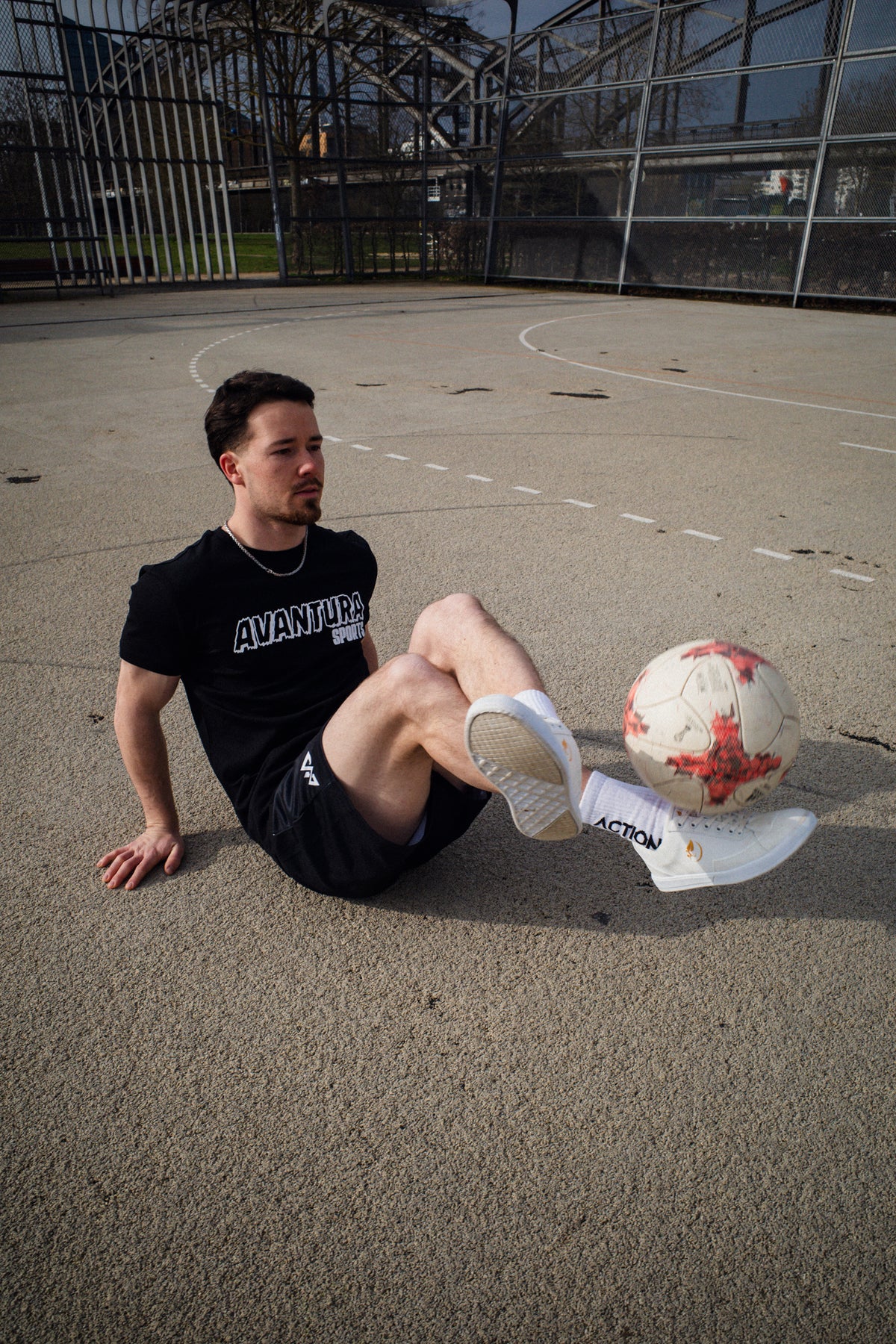 Black Avantaura Sports T-shirt featuring distressed white chest logo text