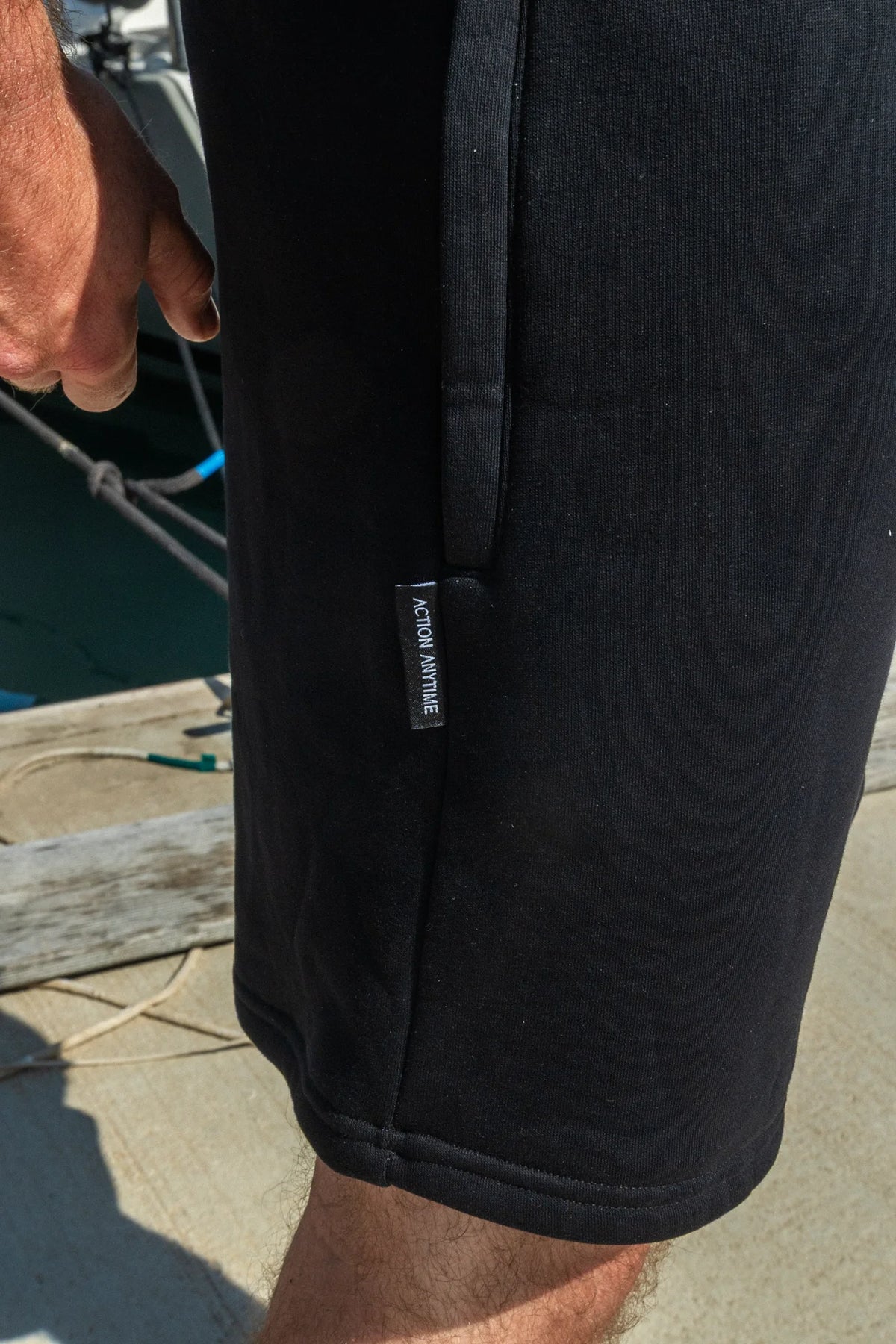 Black shorts zippered pocket and tag detail