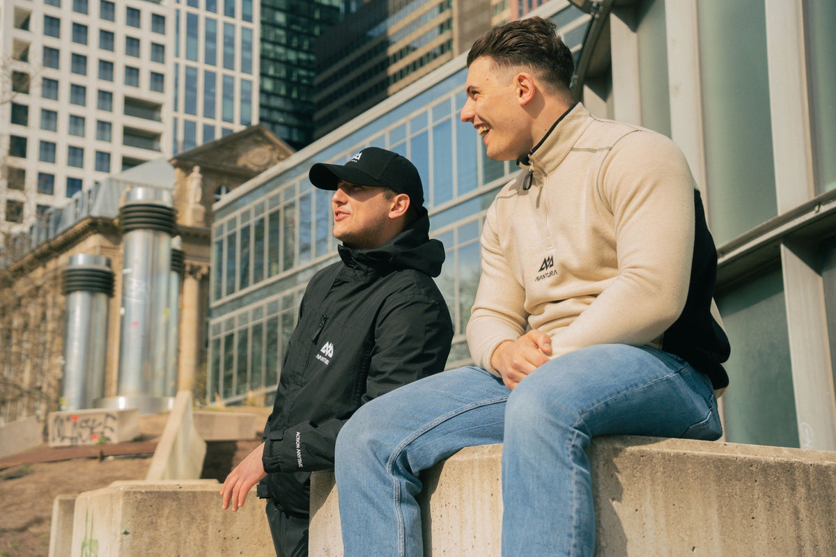 Half-zip fleece sweater in profile with jeans against modern background
