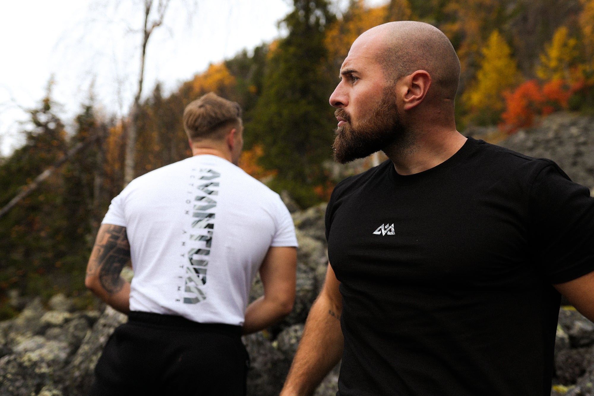 Black T-shirt chest logo and white T-shirt back graphic