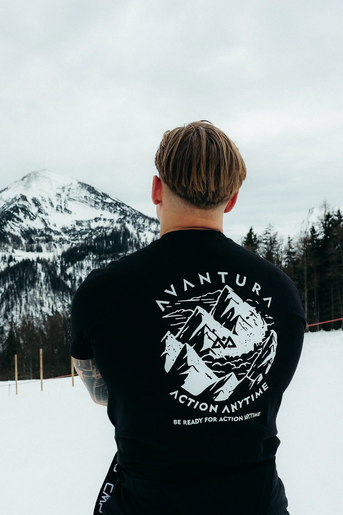 Avantura black T-shirt with arched text and mountain illustration back design