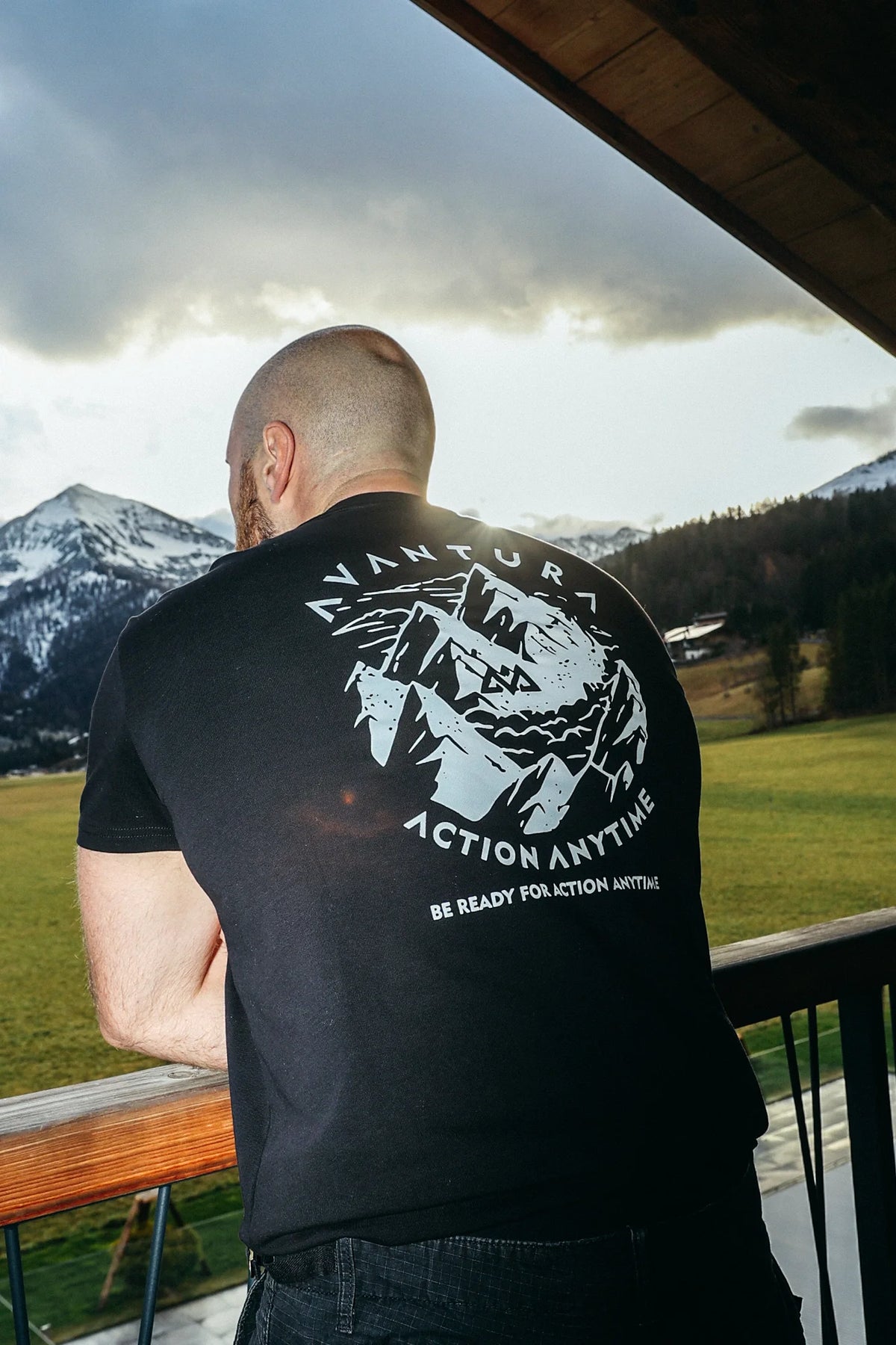 Black T-shirt featuring 'Action Anytime' mountain graphic on back