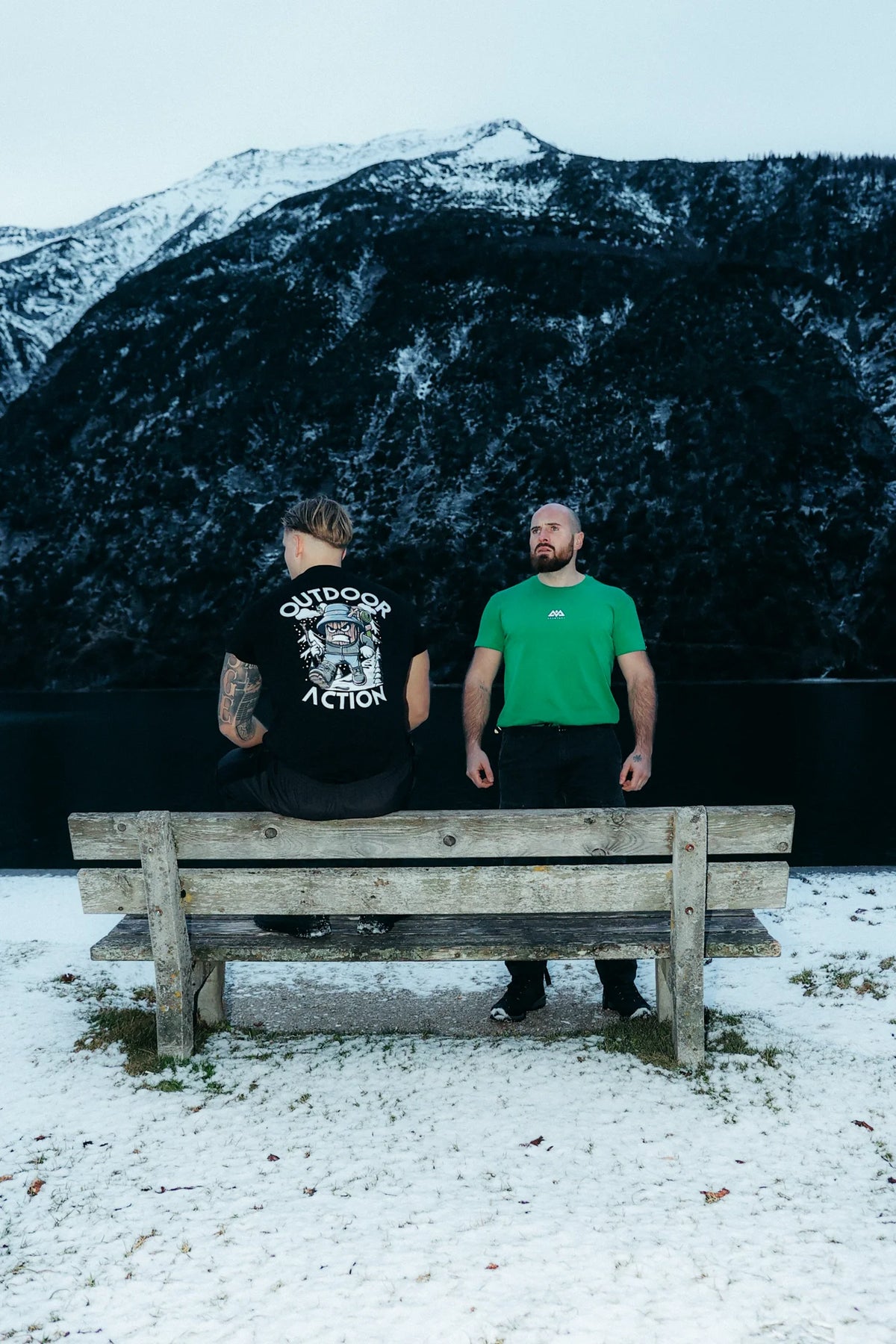 Men's black outdoor action t-shirt with large back graphic print in snowy mountain setting