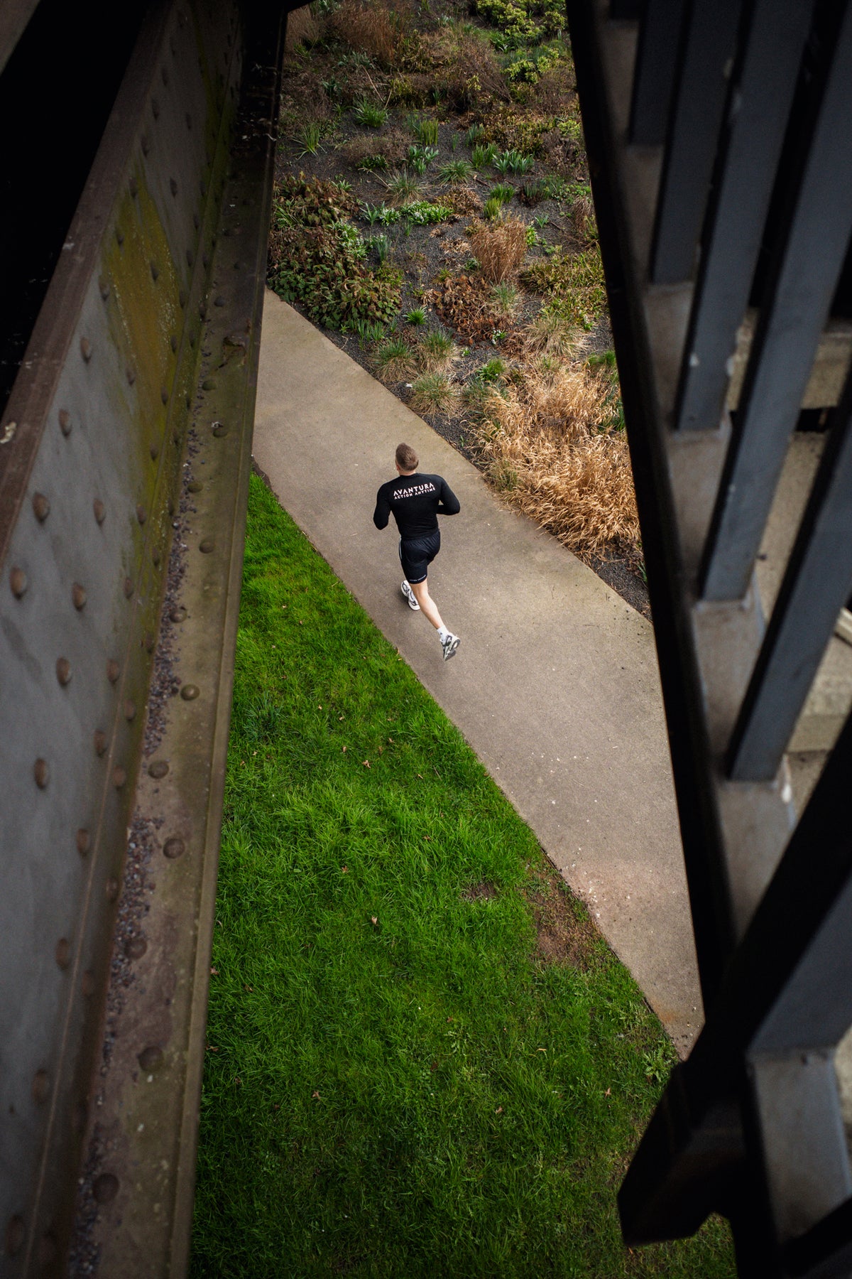 Black long-sleeve shirt with large back print while running