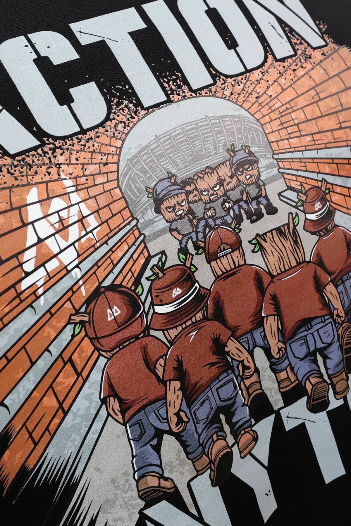Close-up of back print: graffiti wall and figures in tunnel on black