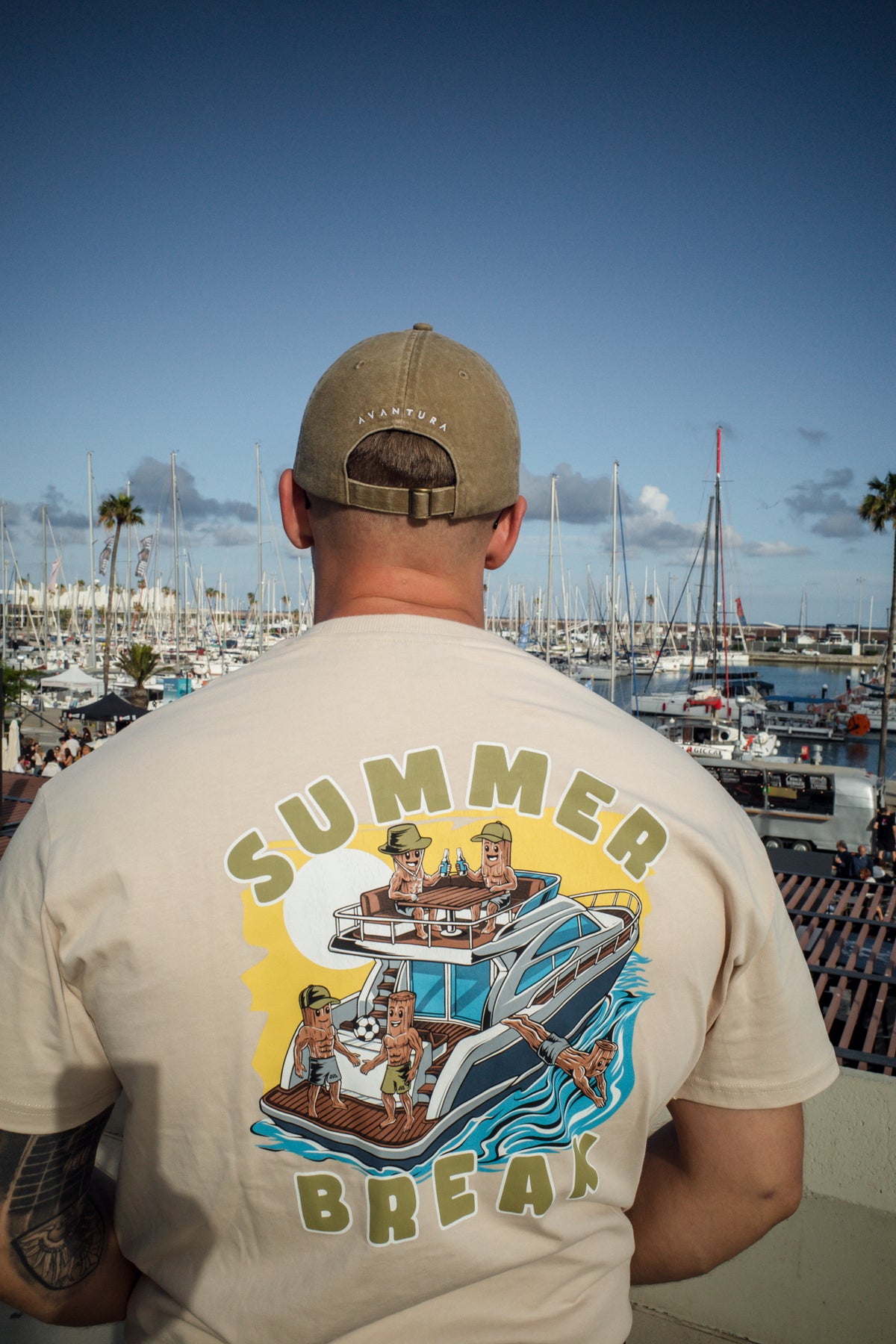Large colorful Summer Break back graphic on cream oversized t-shirt