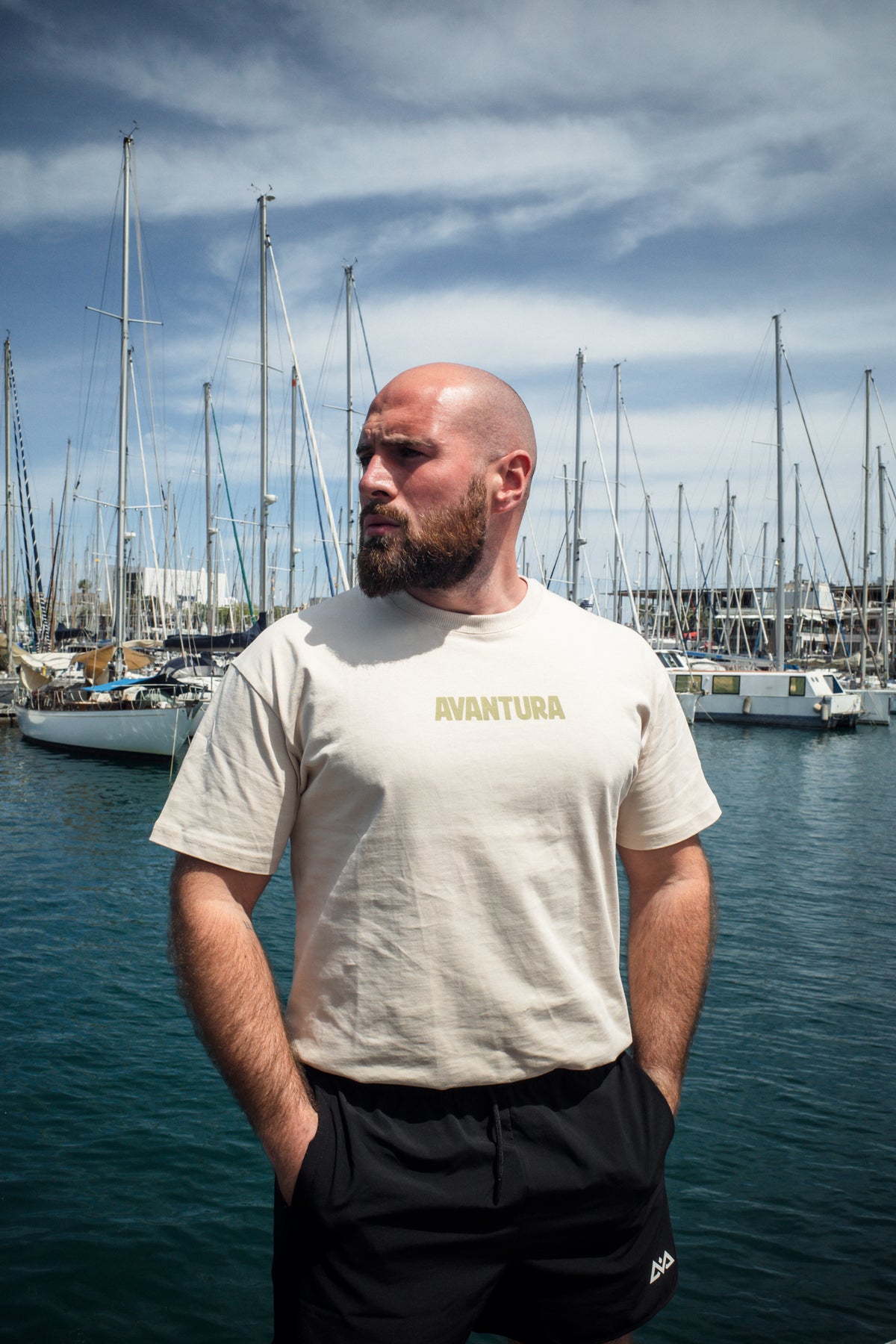 Cream oversized t-shirt with gold Avantura logo print on chest
