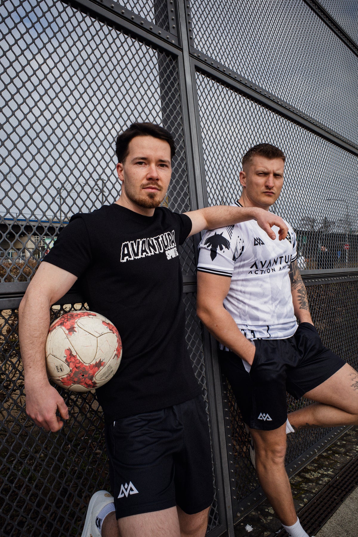 Athletes wearing black mesh shorts with white logos