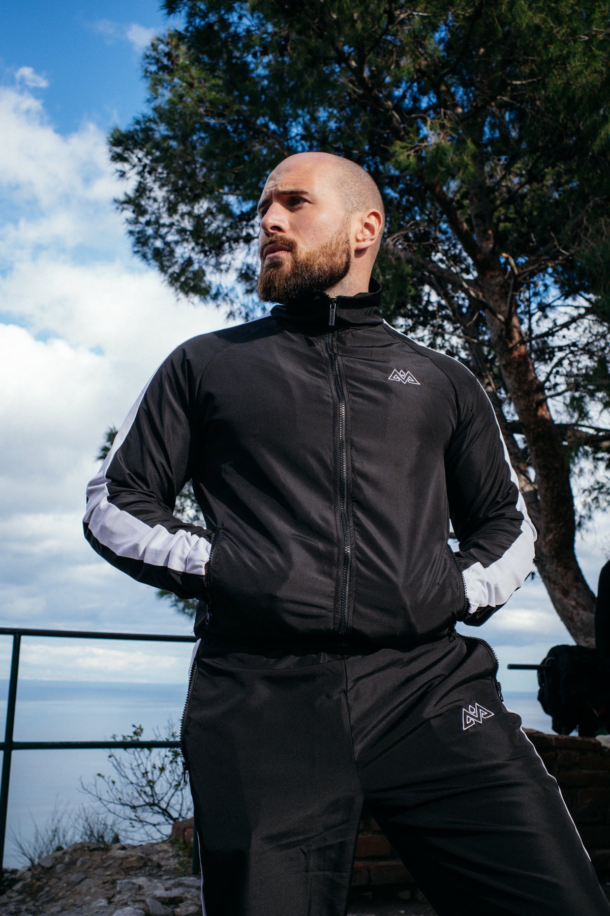 Black training jacket with embroidered chest logo