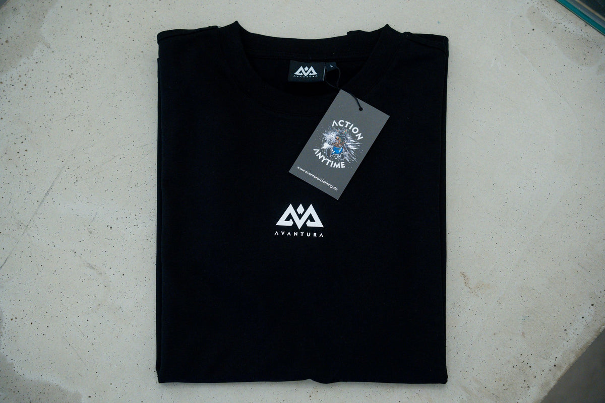 Folded black T-shirt with white logo and Action Anytime label