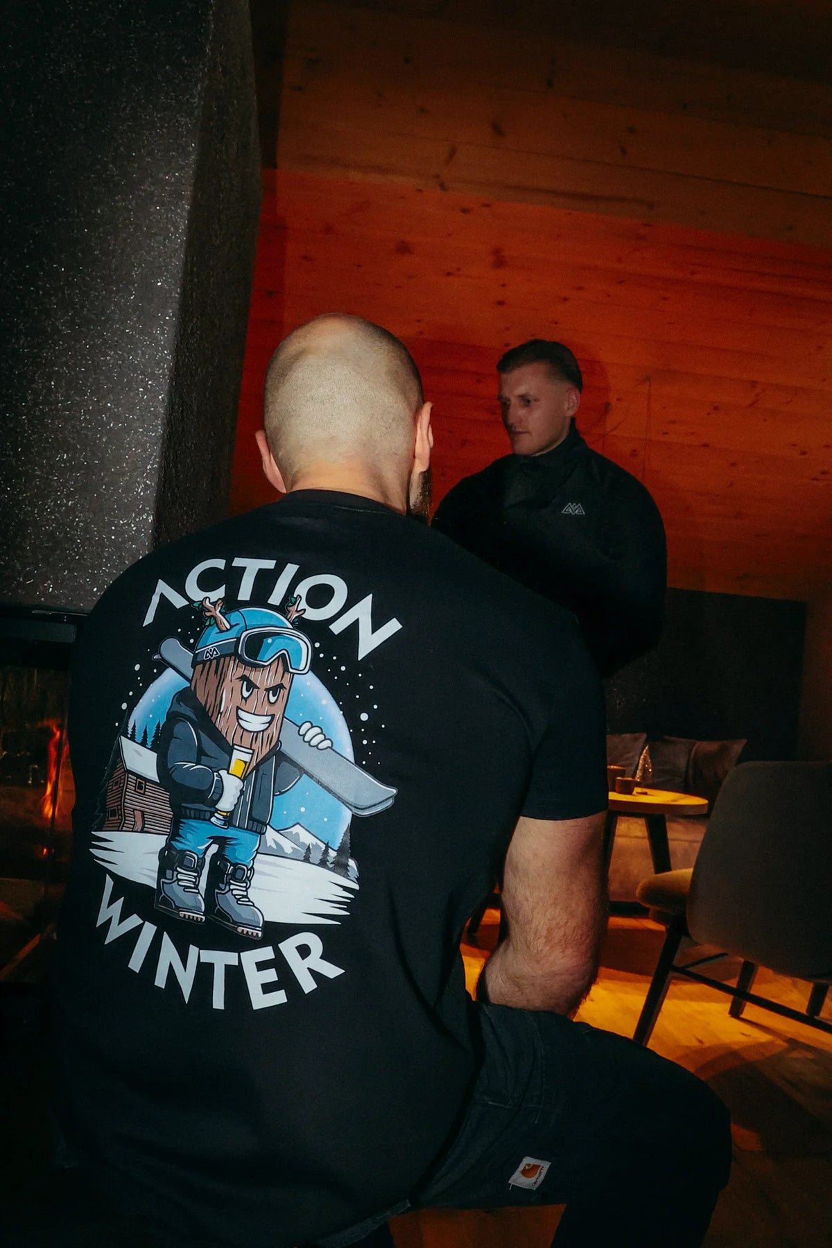 Black short-sleeve T-shirt with detailed cartoon woodchuck snowboarder graphic on back