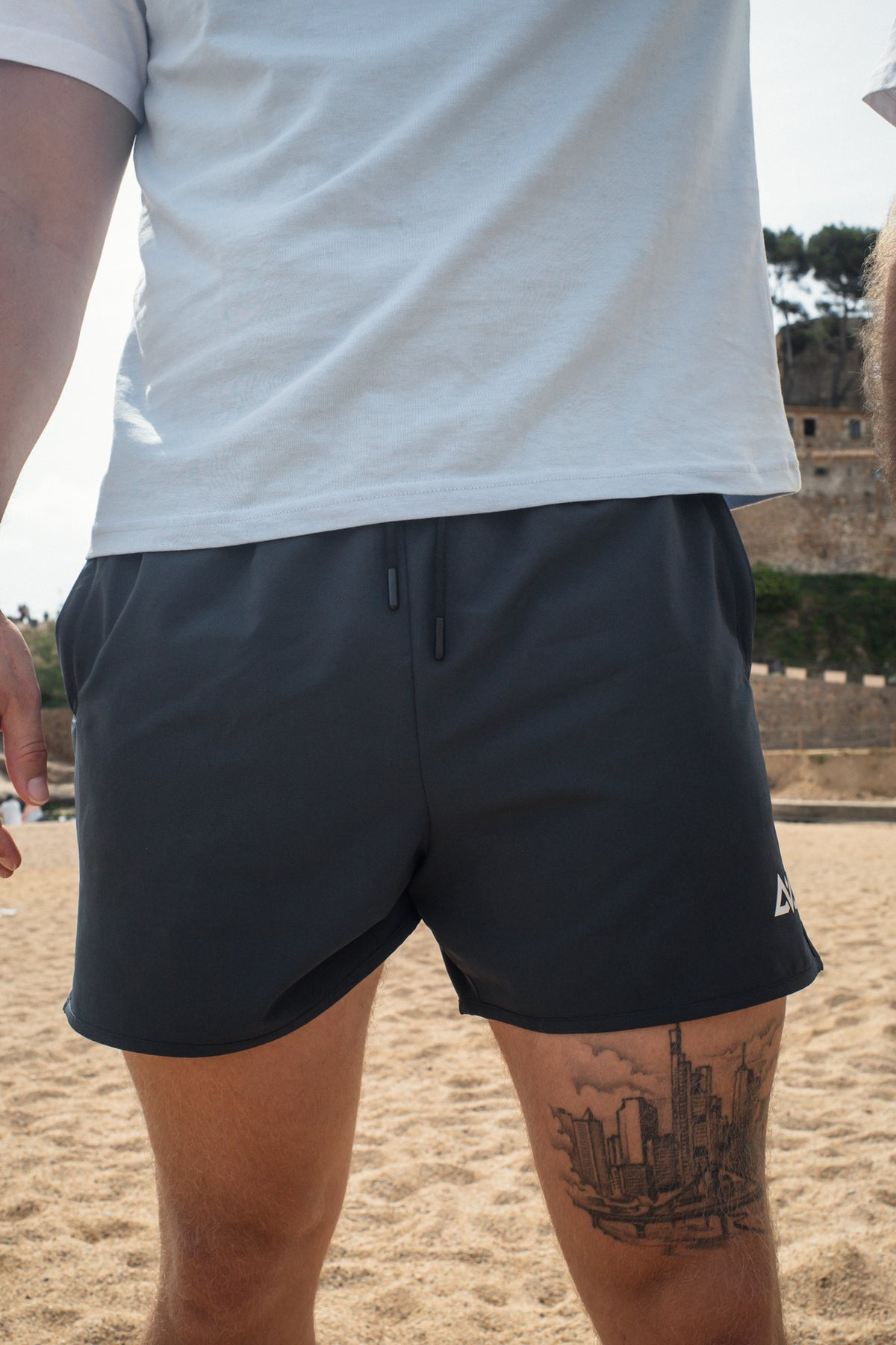Front view of navy sport shorts with elastic drawstring waistband