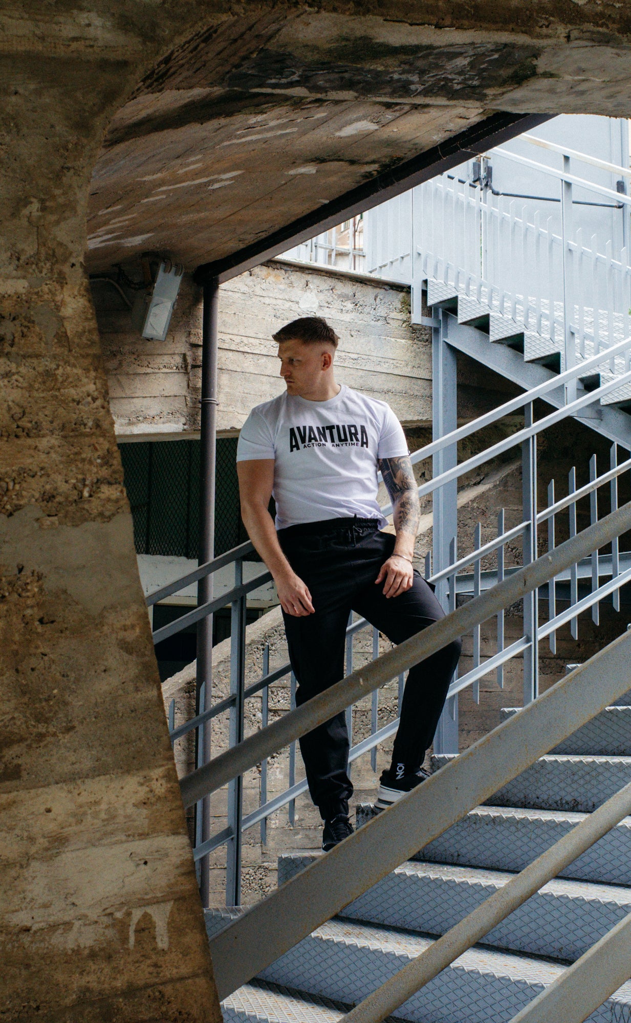White crew-neck Avantura T-shirt with black graphic print detail