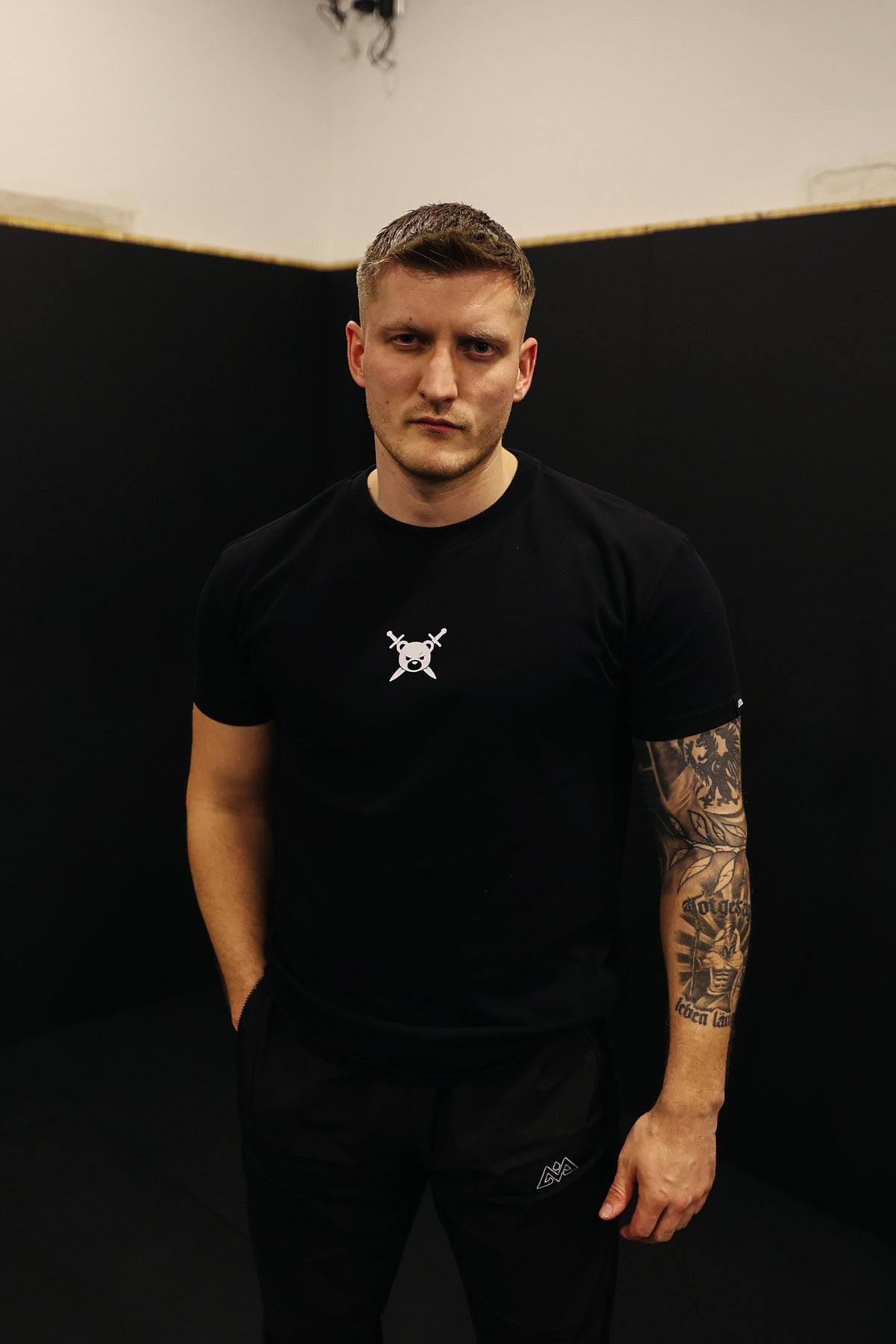 Black AVANTURA T-shirt with centered logo and black pants