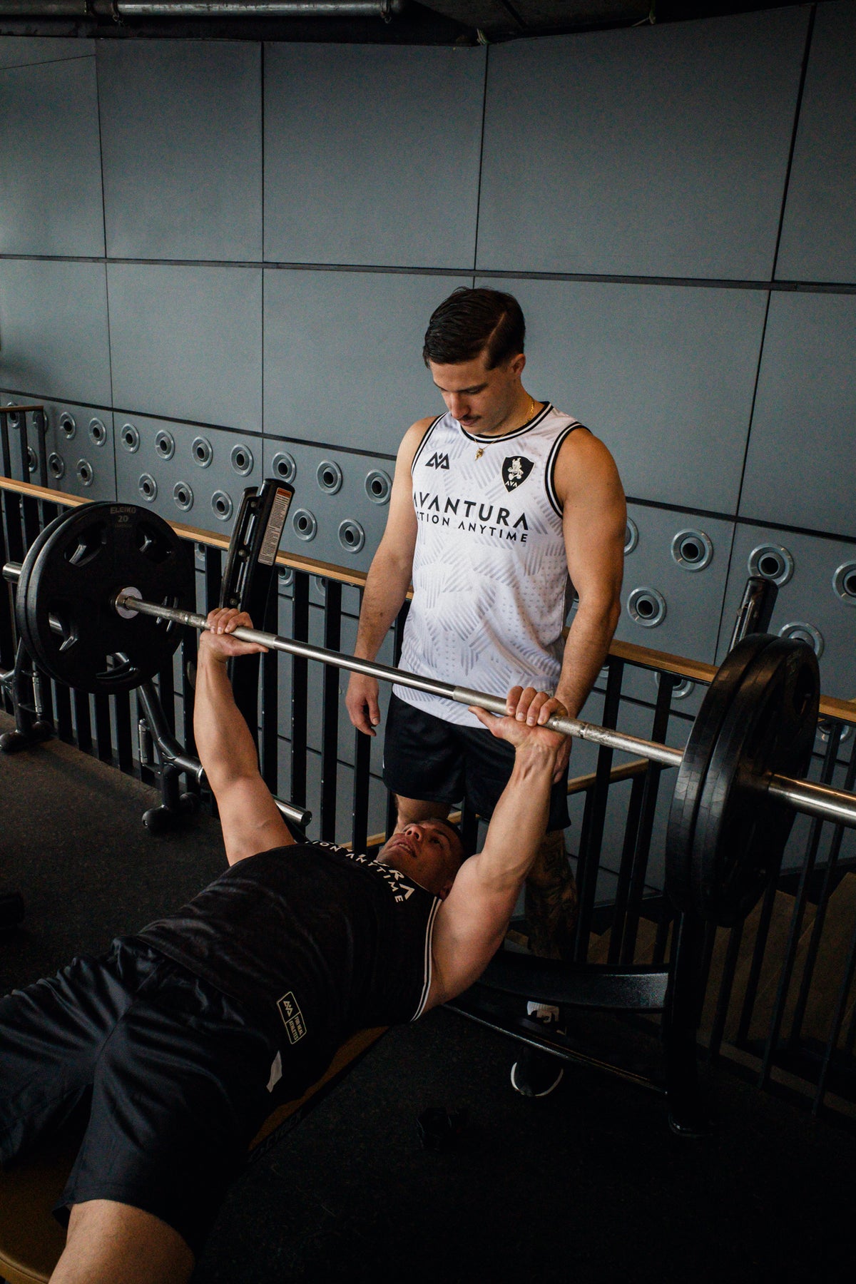 Gym scene featuring white and black Avantura sleeveless workout tops