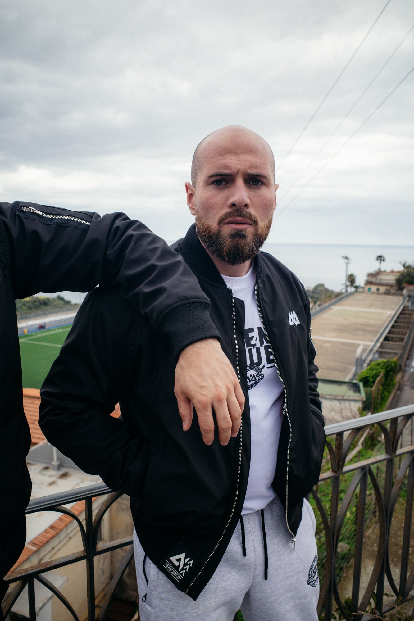 Black bomber jacket with rubber hem patch detail