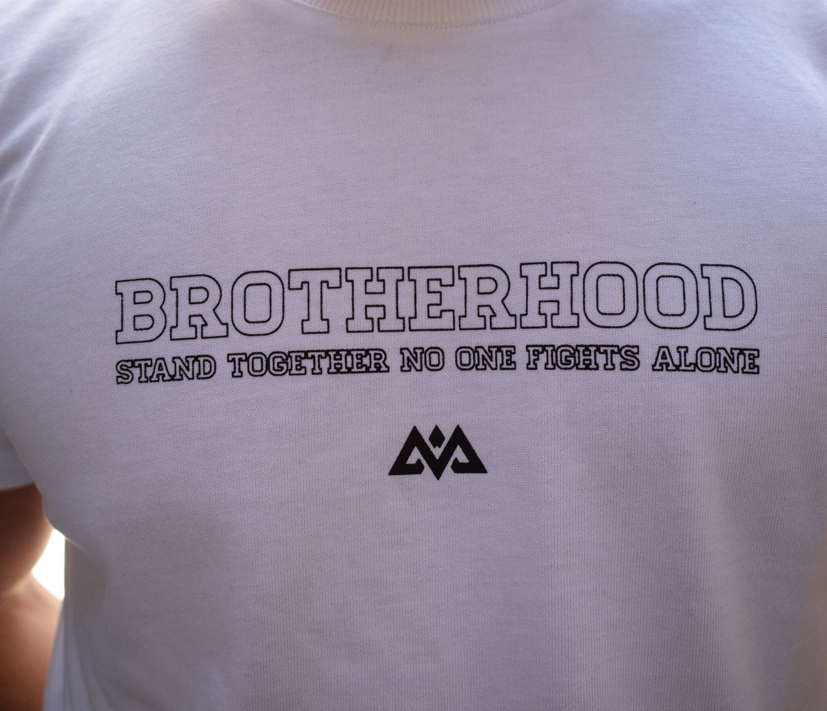 Front view of white t-shirt with Brotherhood chest logo and slogan