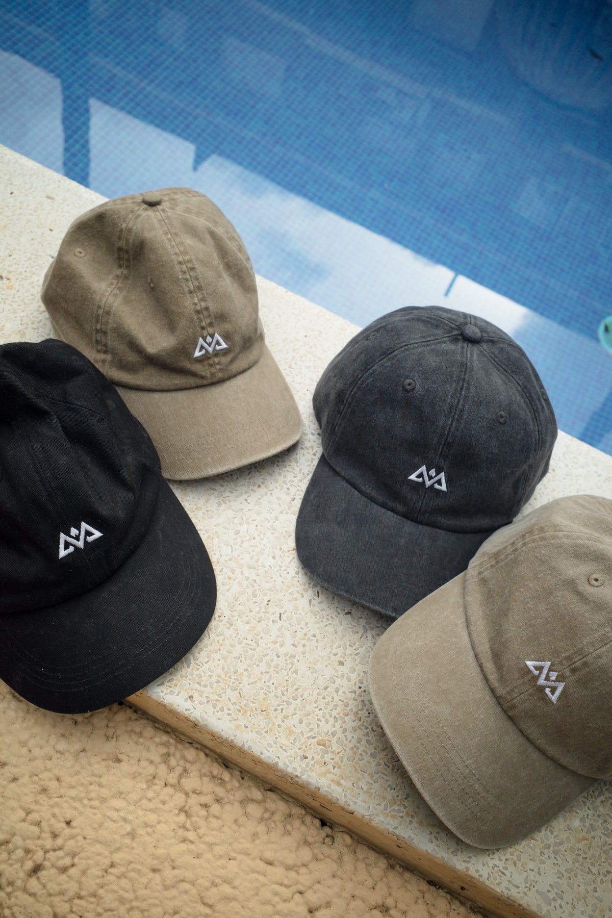 Avantura caps in black, gray, and tan colors