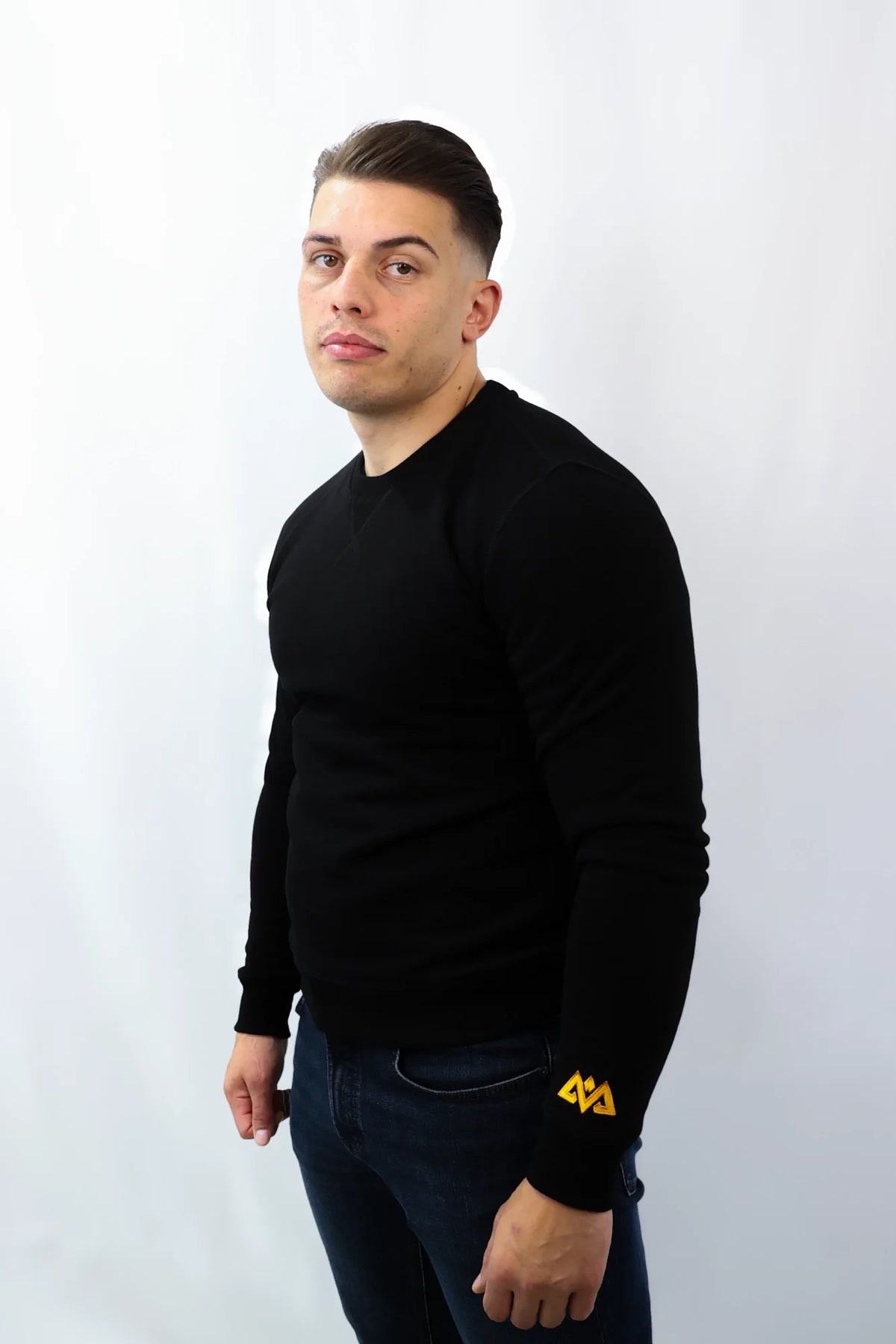 Men's black crewneck sweater fit and style on model