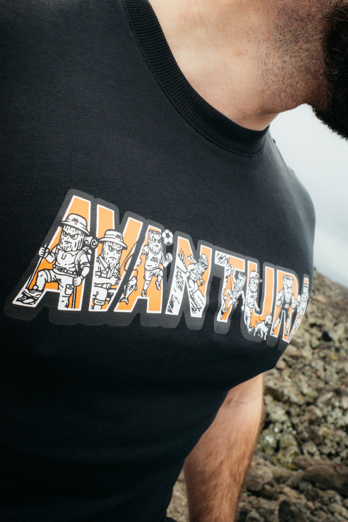 Extreme close-up of ribbed collar and detailed cartoon art inside block letters