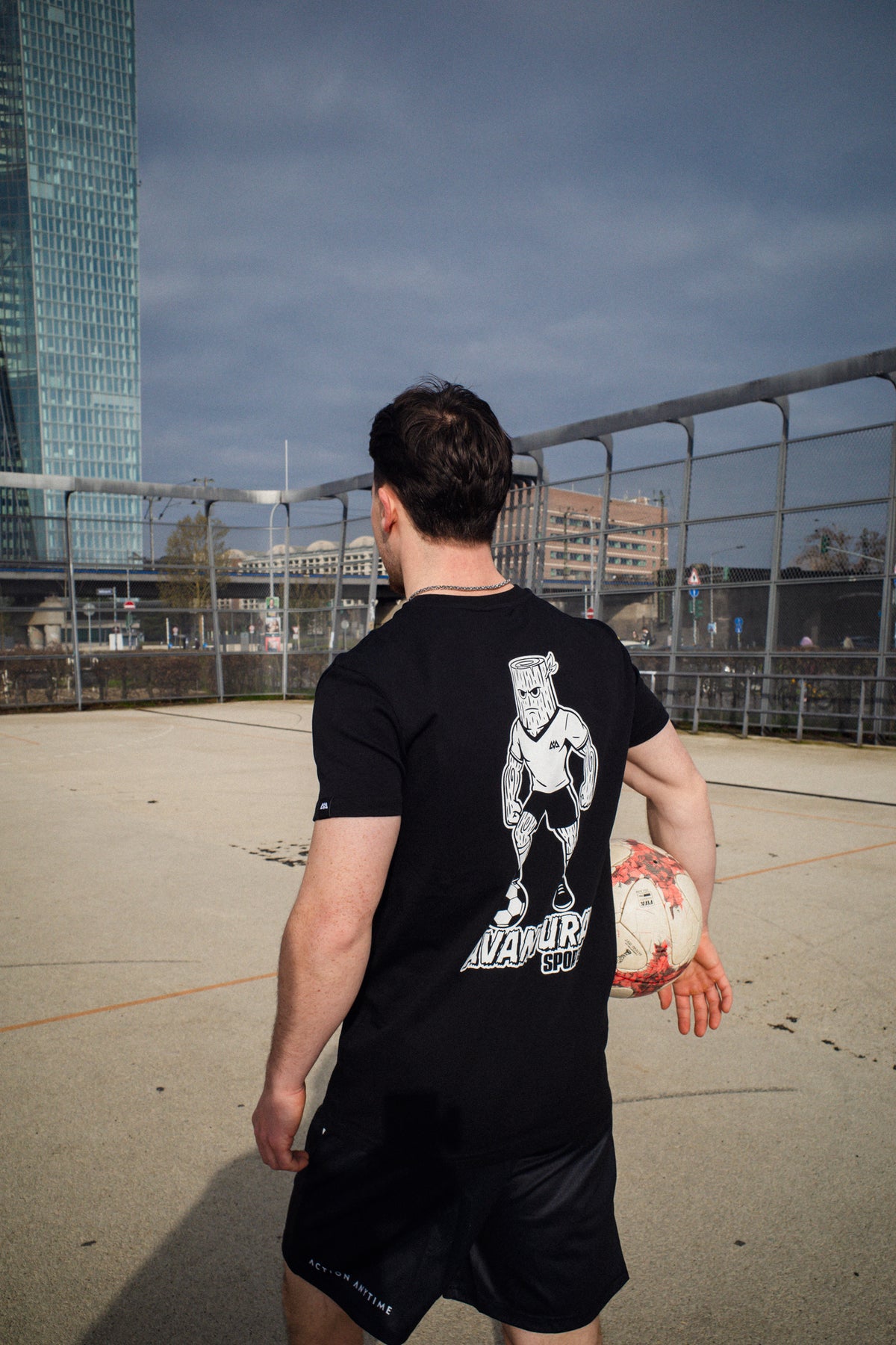 Black Avantaura Sports T-shirt with large white wooden character back print