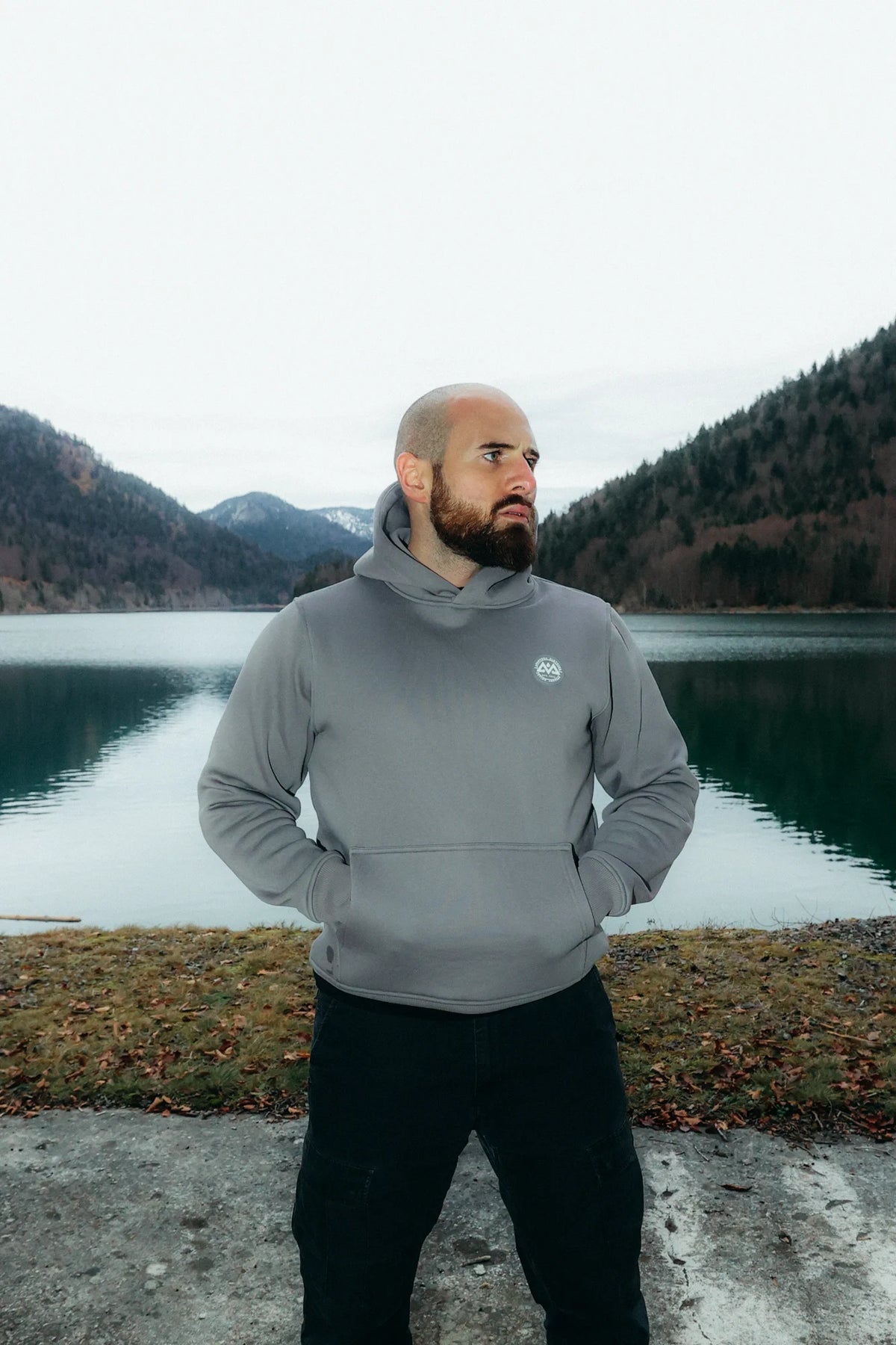 Gray hoodie with round rubber logo on the chest