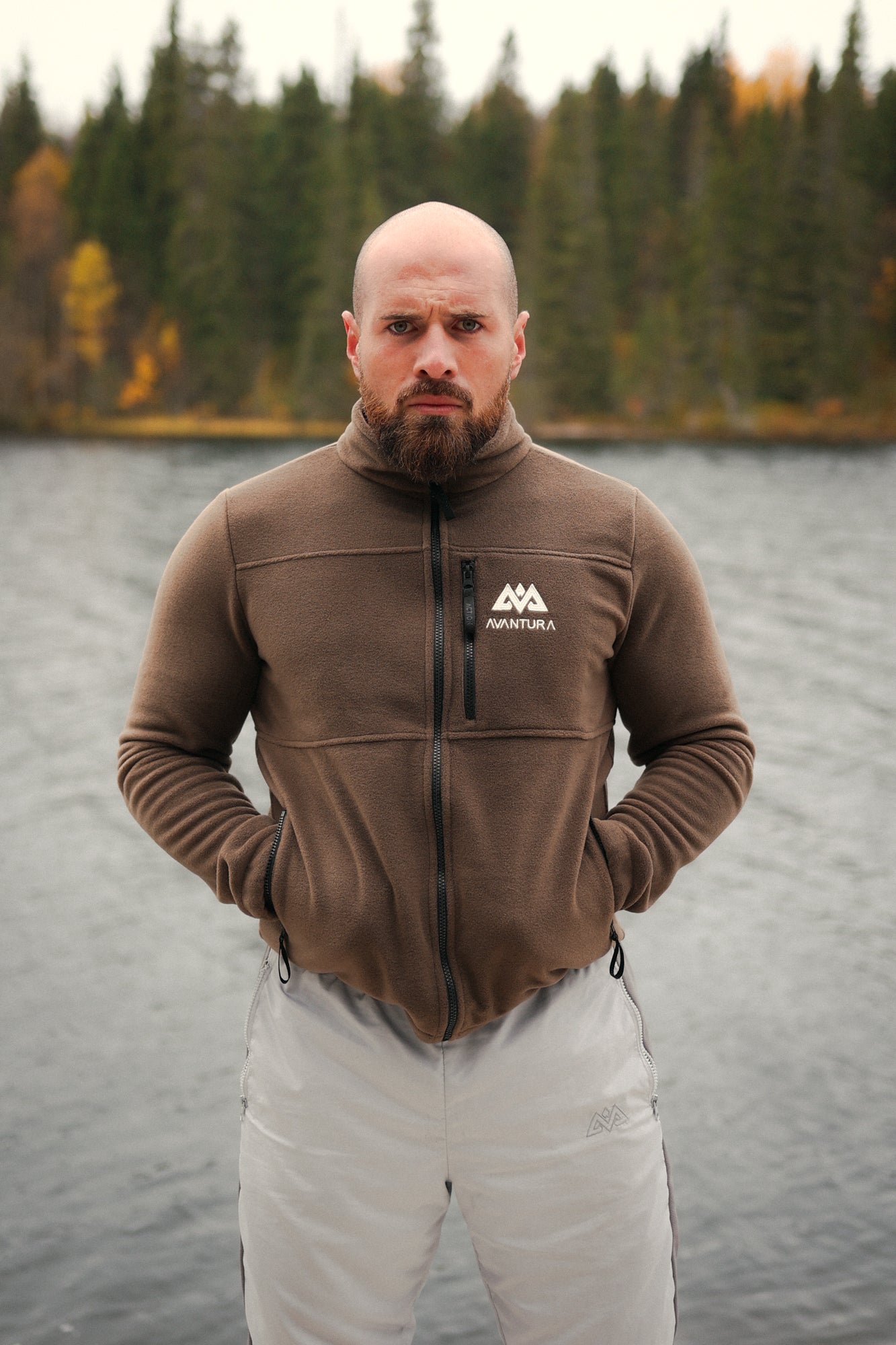 Front view of brown fleece jacket with adjustable hem drawstrings