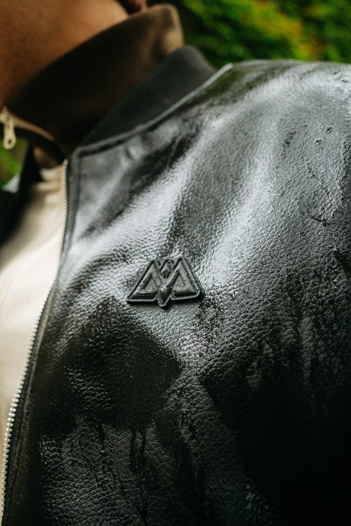Texture and metal zipper of the black faux leather jacket