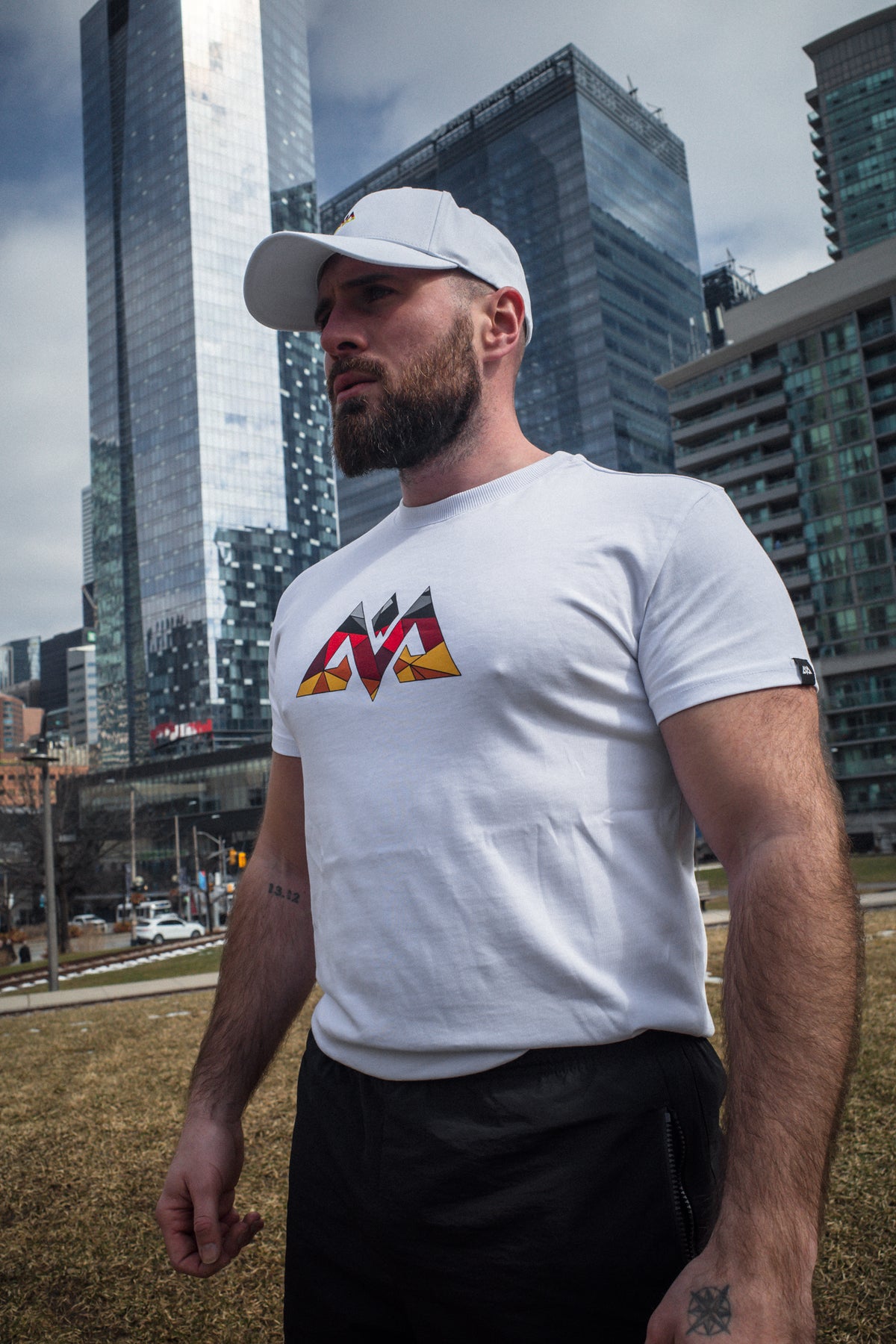 White MOSAIK T-shirt side view showing sleeve tag