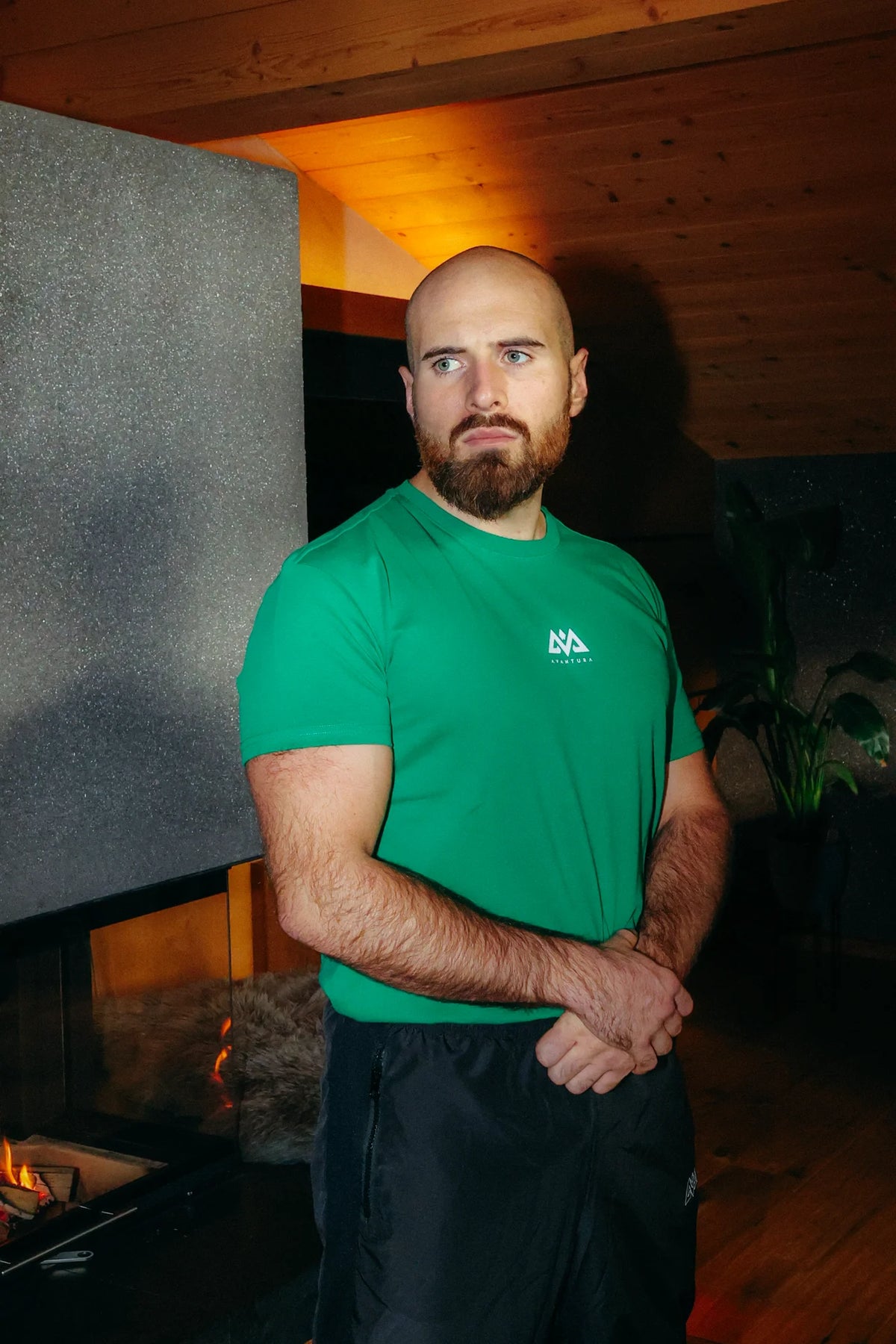 Green T-shirt with white chest logo